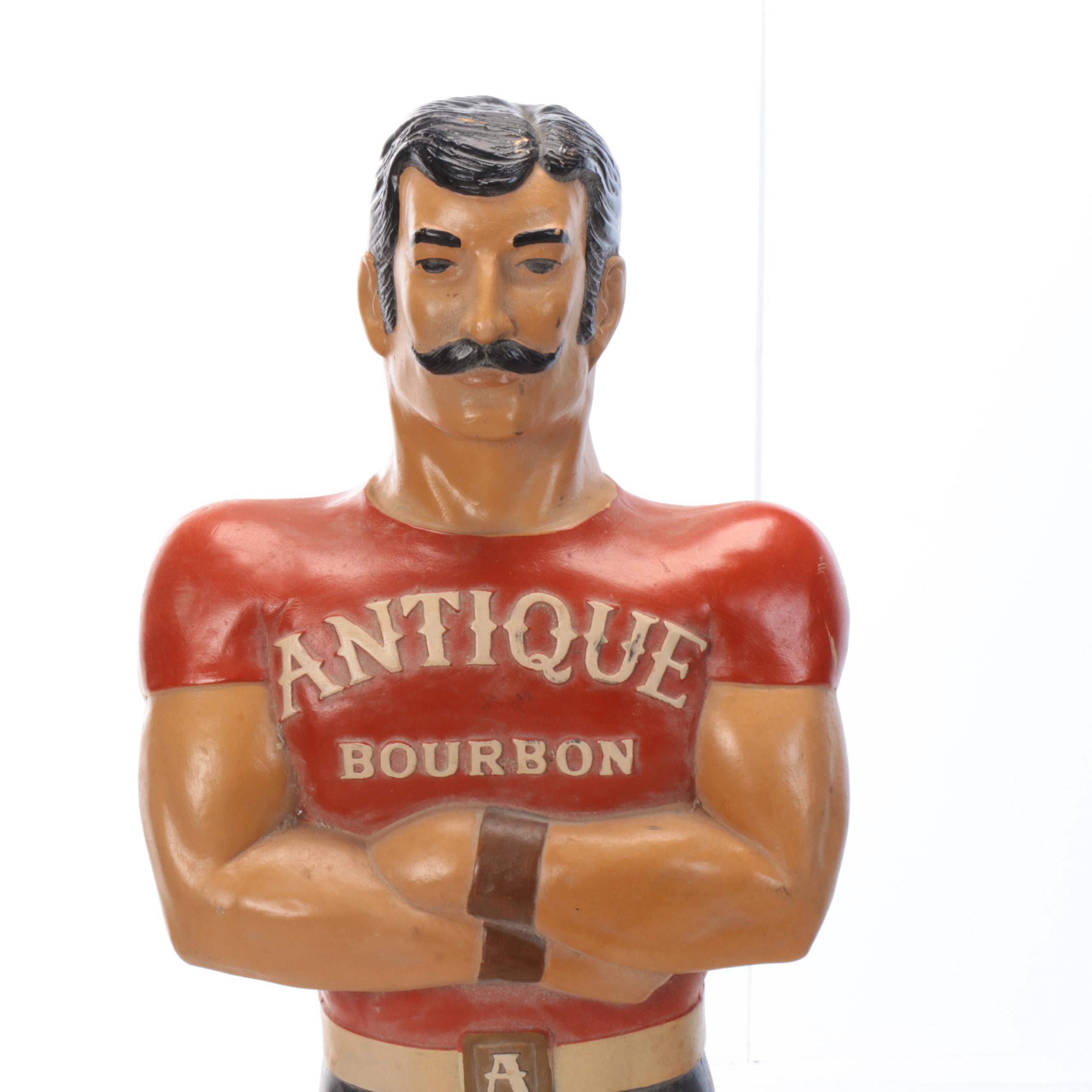 Antique Bourbon Weightlifter Advertising Figurine, Mid-20th Century