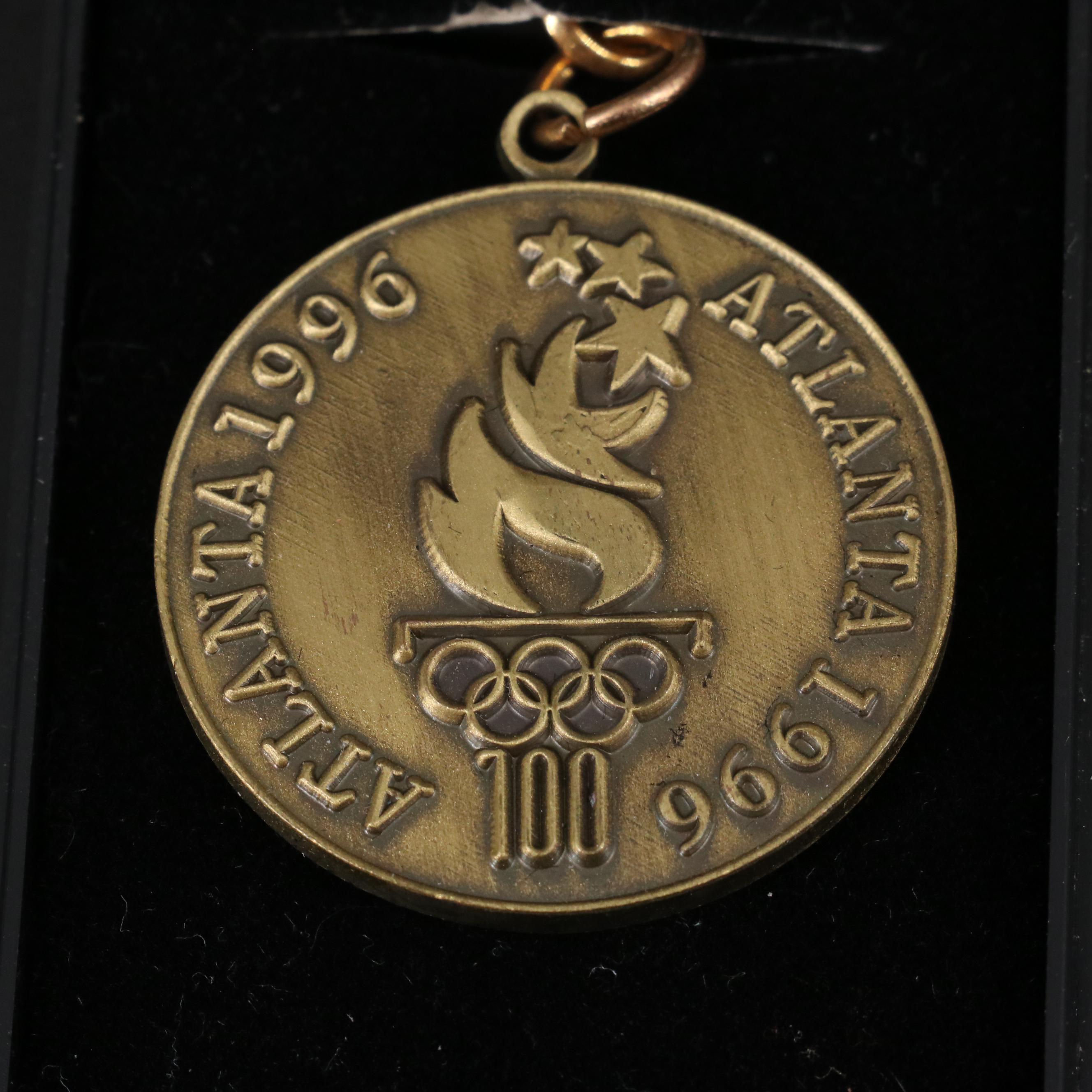 Twenty Commemorative Olympic Pins and a Commemorative Medal