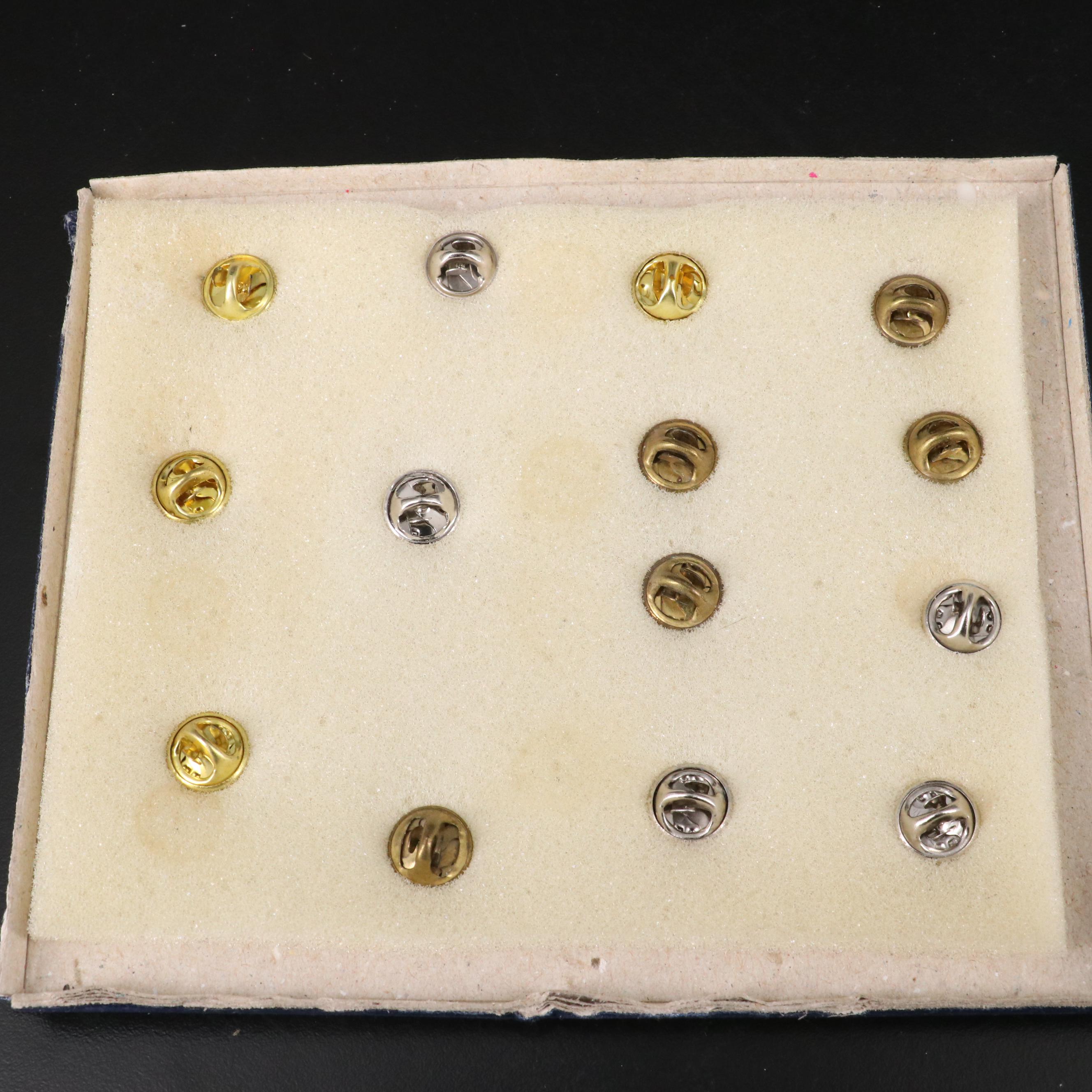 Twenty Commemorative Olympic Pins and a Commemorative Medal