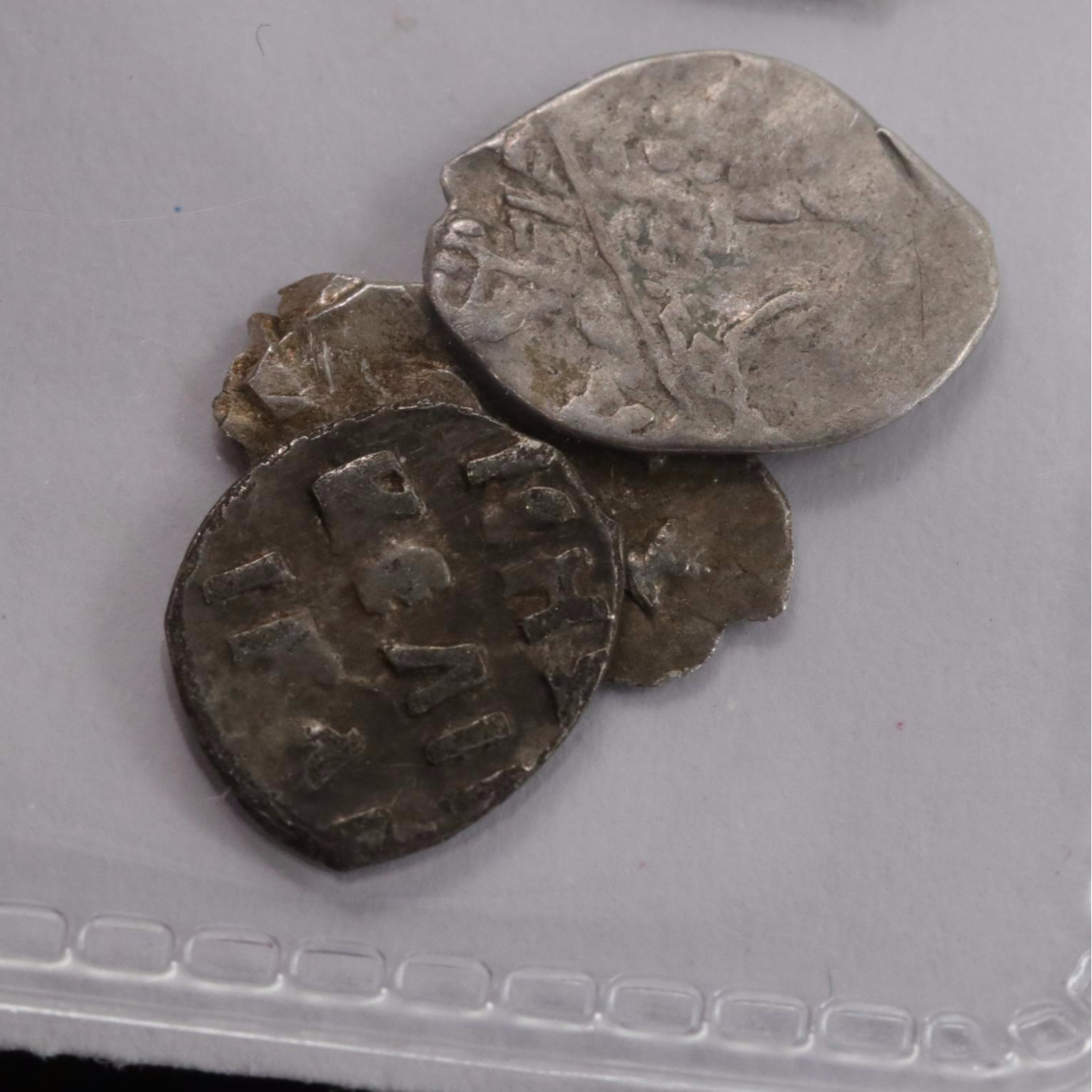 Twelve Russian Silver "Wire Money" Coins, ca. 1500 to 1700