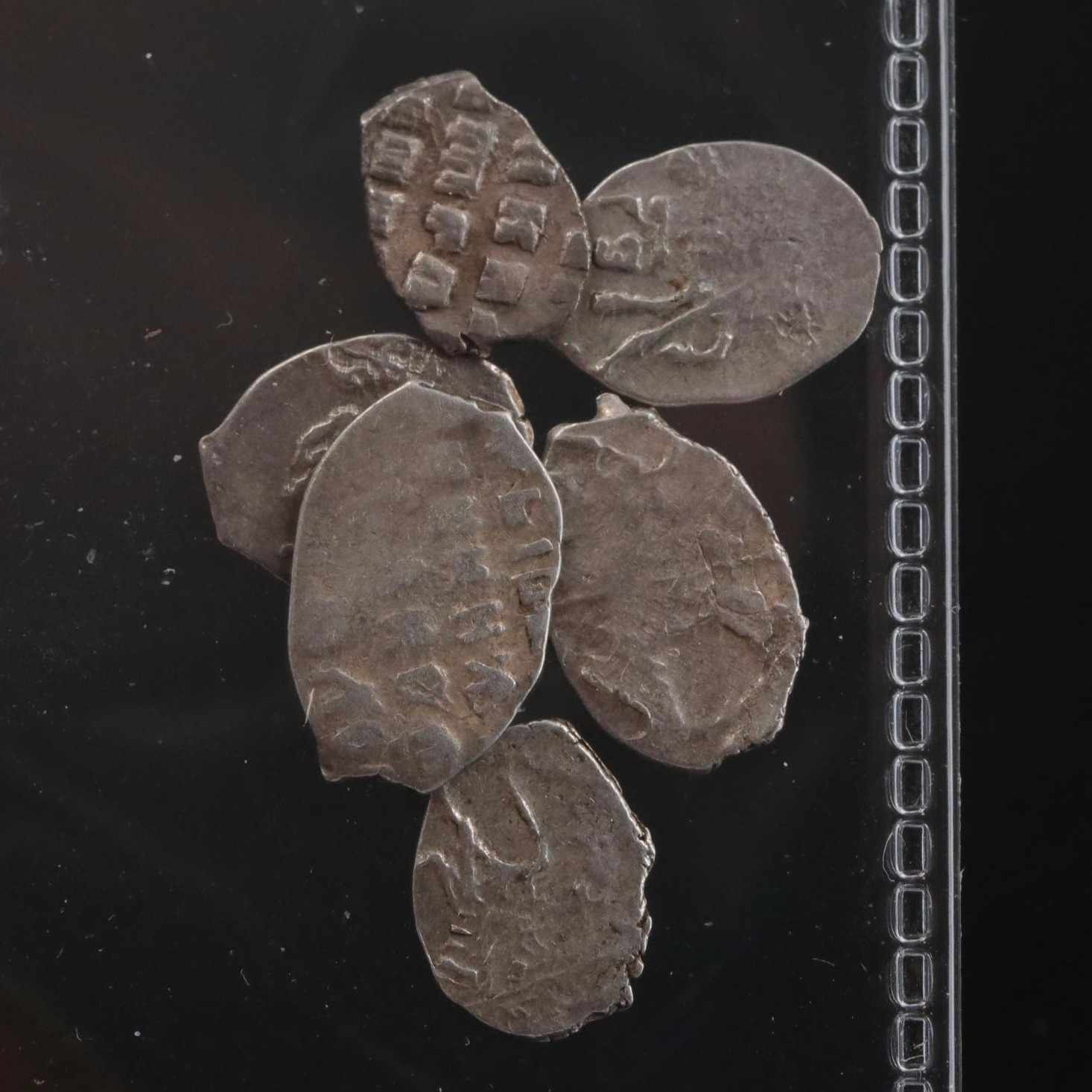 Twelve Russian Silver "Wire Money" Coins, ca. 1500 to 1700