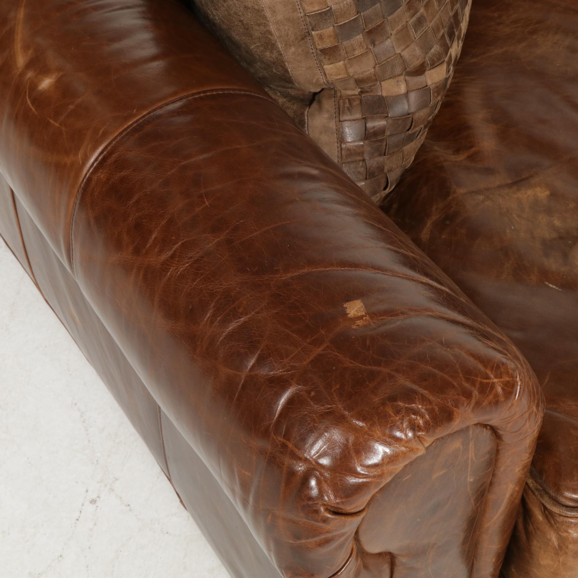 Distressed Brown Leather Sofa by Superb Creation Ltd. and Basket Weave Pillows