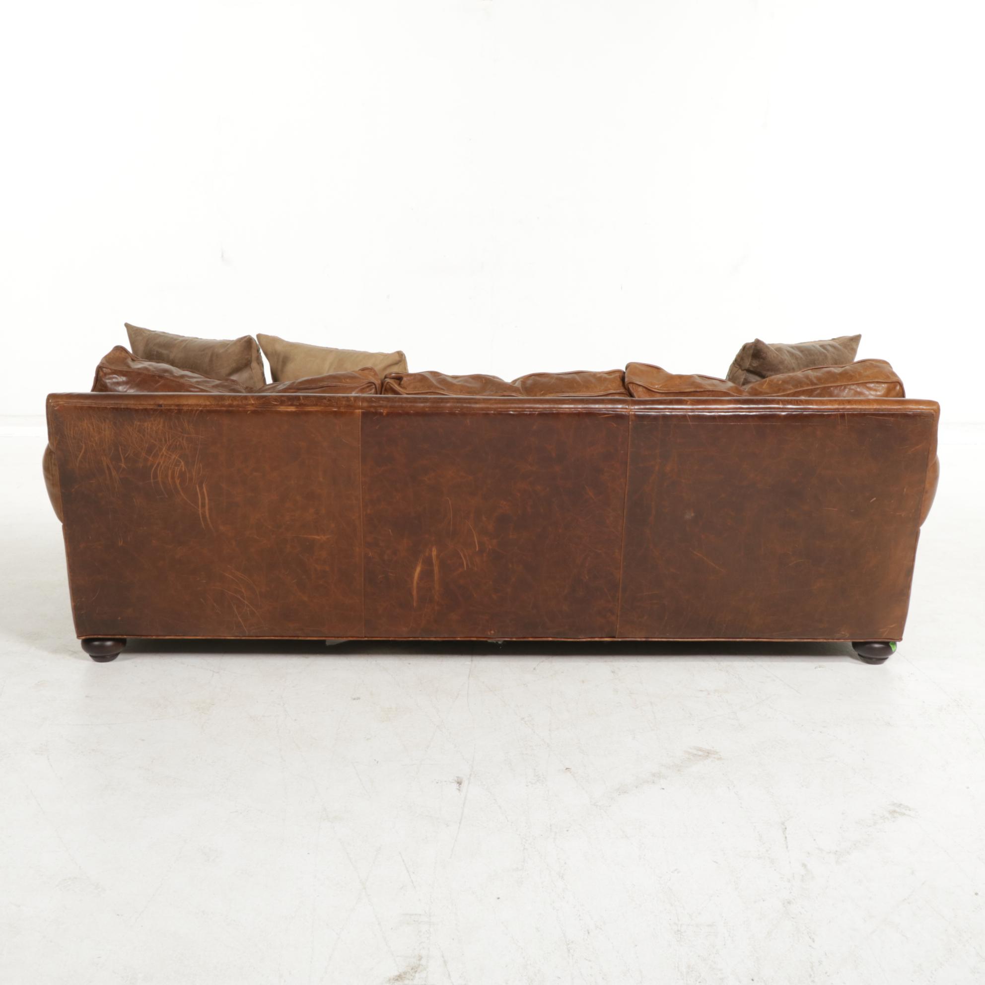 Distressed Brown Leather Sofa by Superb Creation Ltd. and Basket Weave Pillows