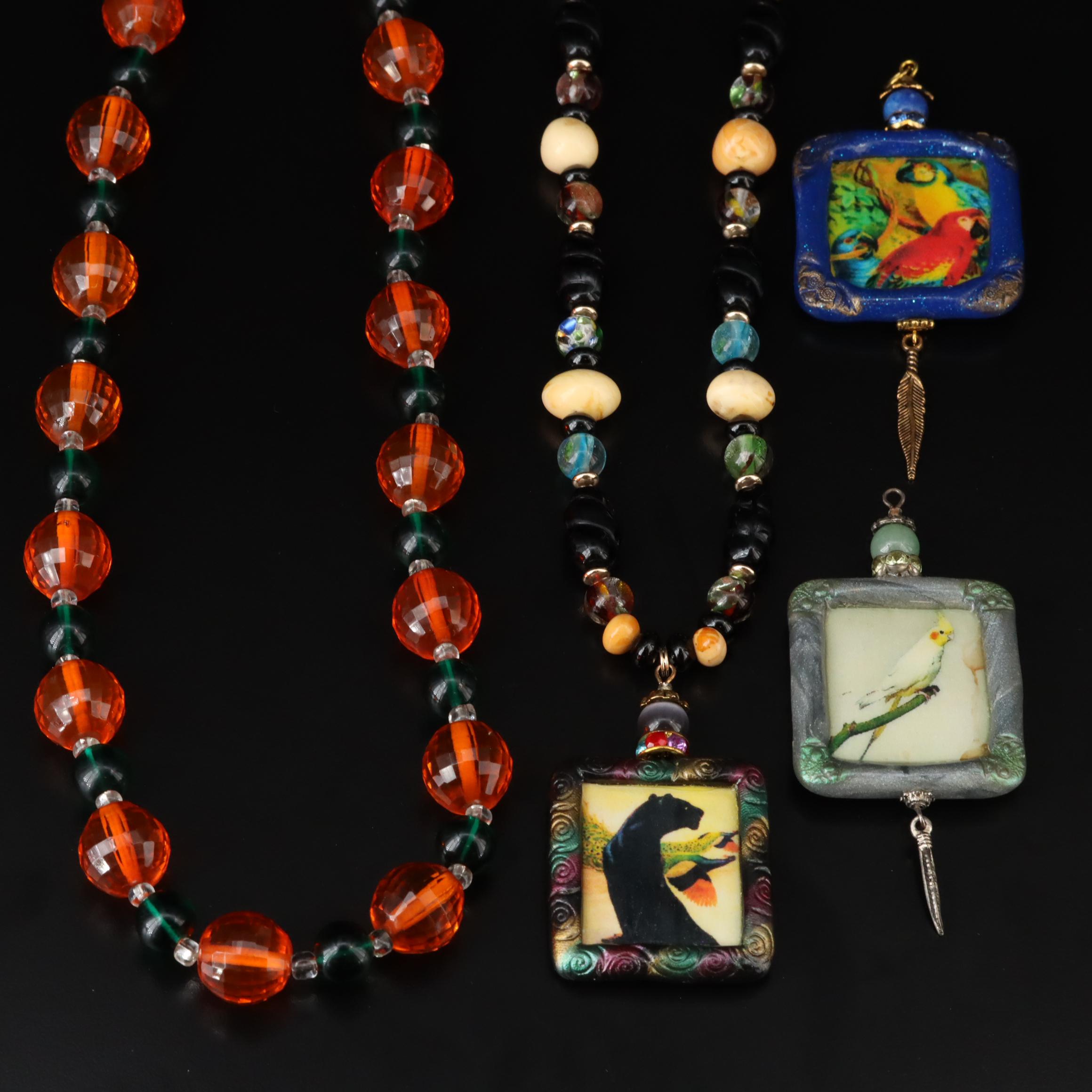 The Indigo Dragon and Art Glass Featured in Necklace and Pendant Collection