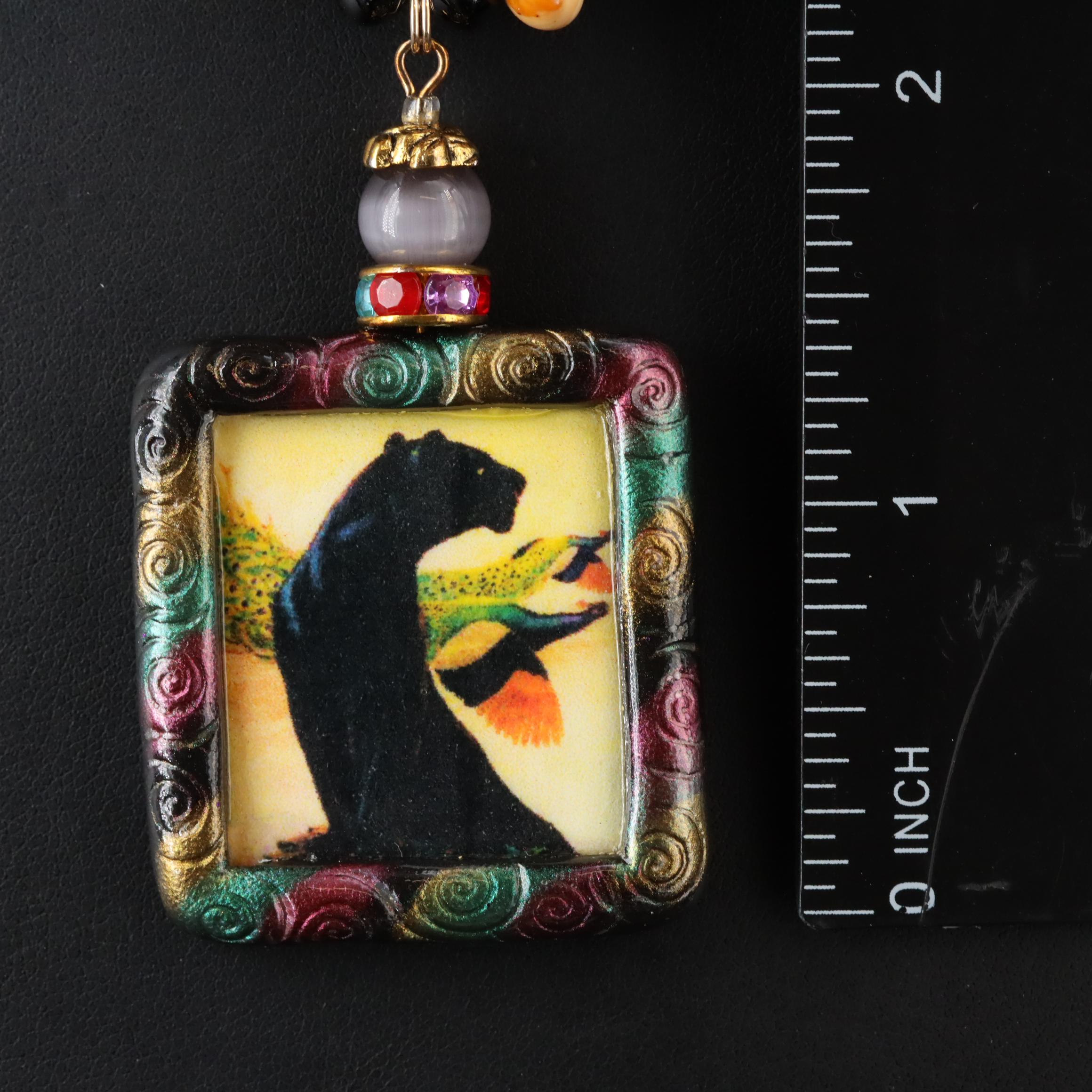 The Indigo Dragon and Art Glass Featured in Necklace and Pendant Collection