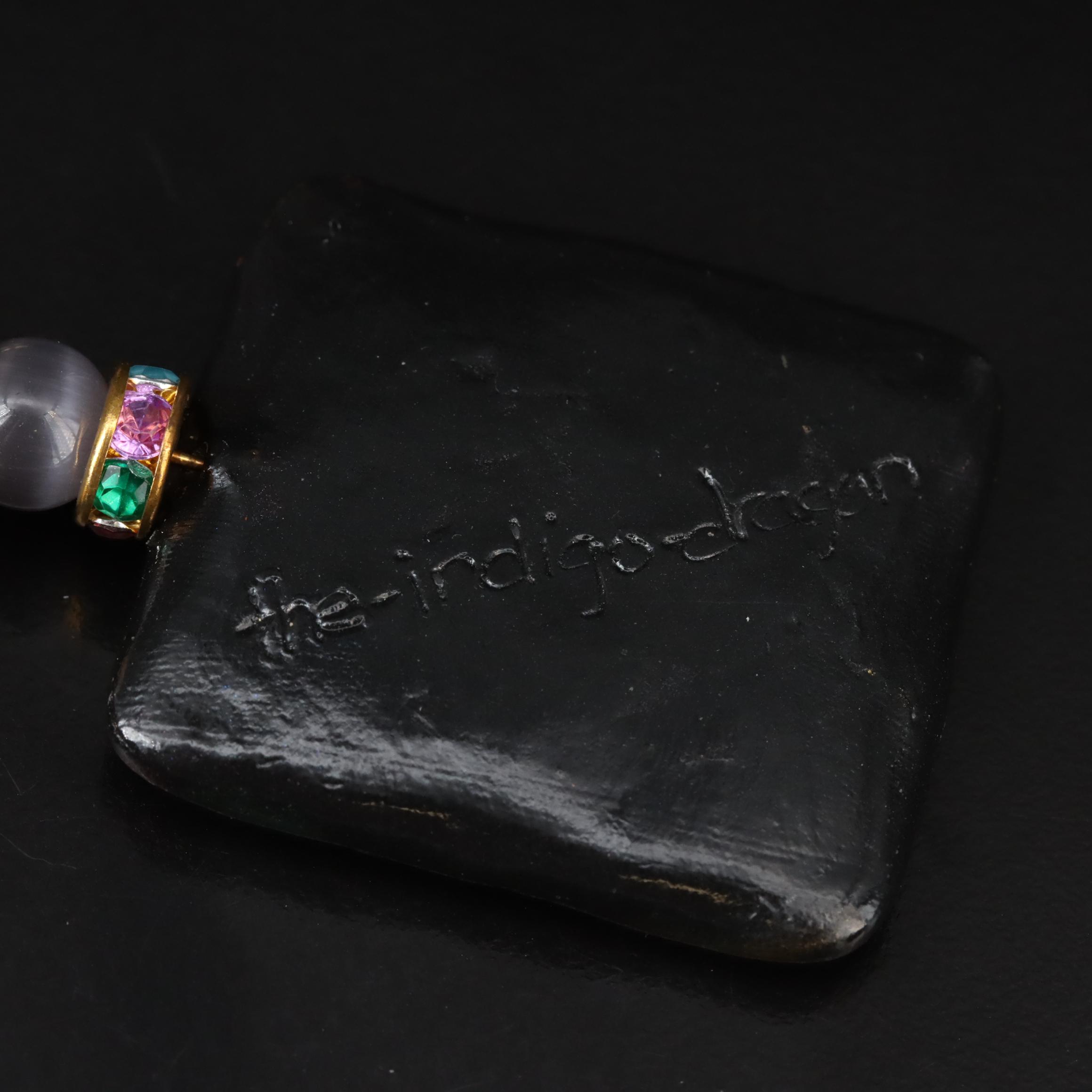 The Indigo Dragon and Art Glass Featured in Necklace and Pendant Collection