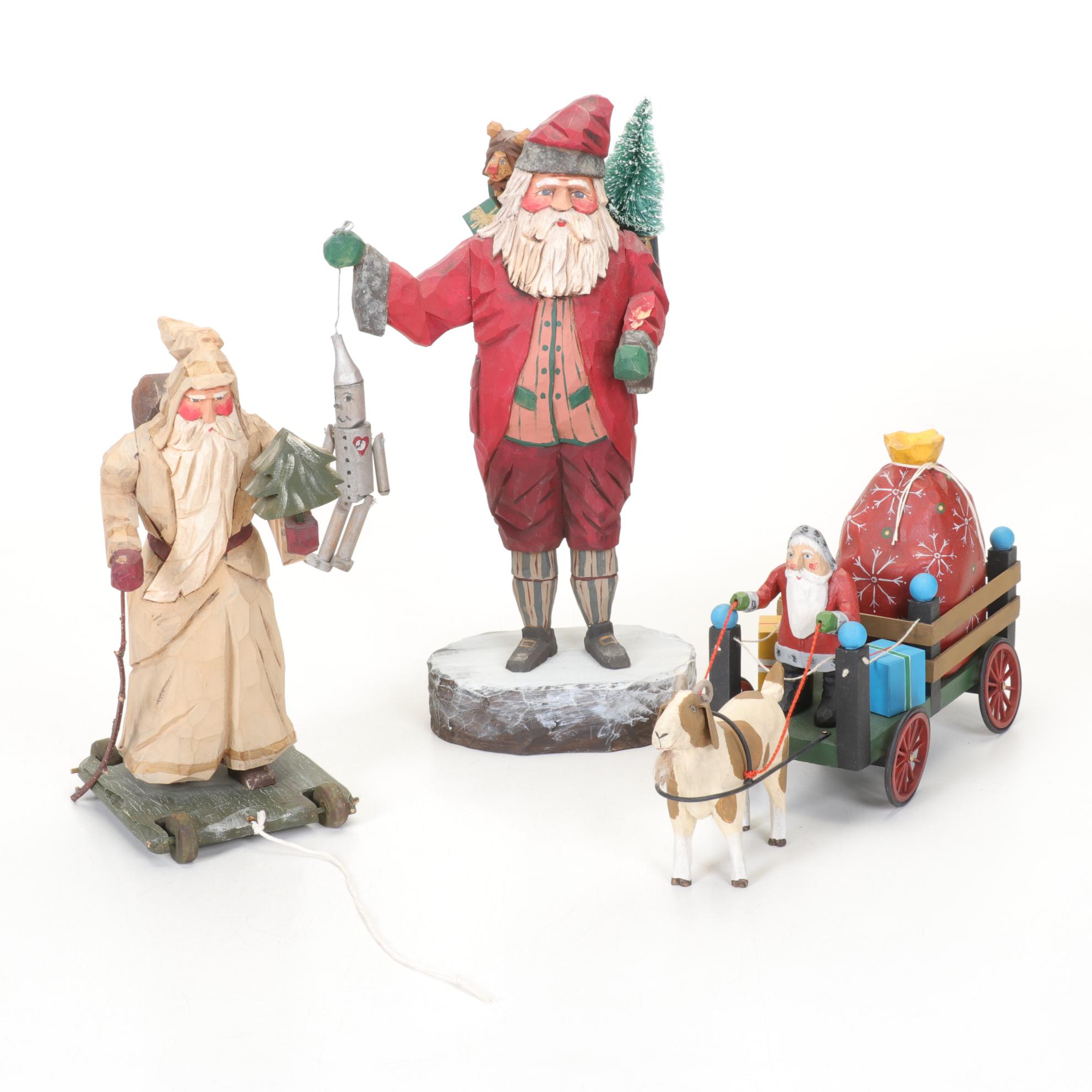 Carved Wood and Hand-Painted Folk Art Santa Figurines Including Rawson
