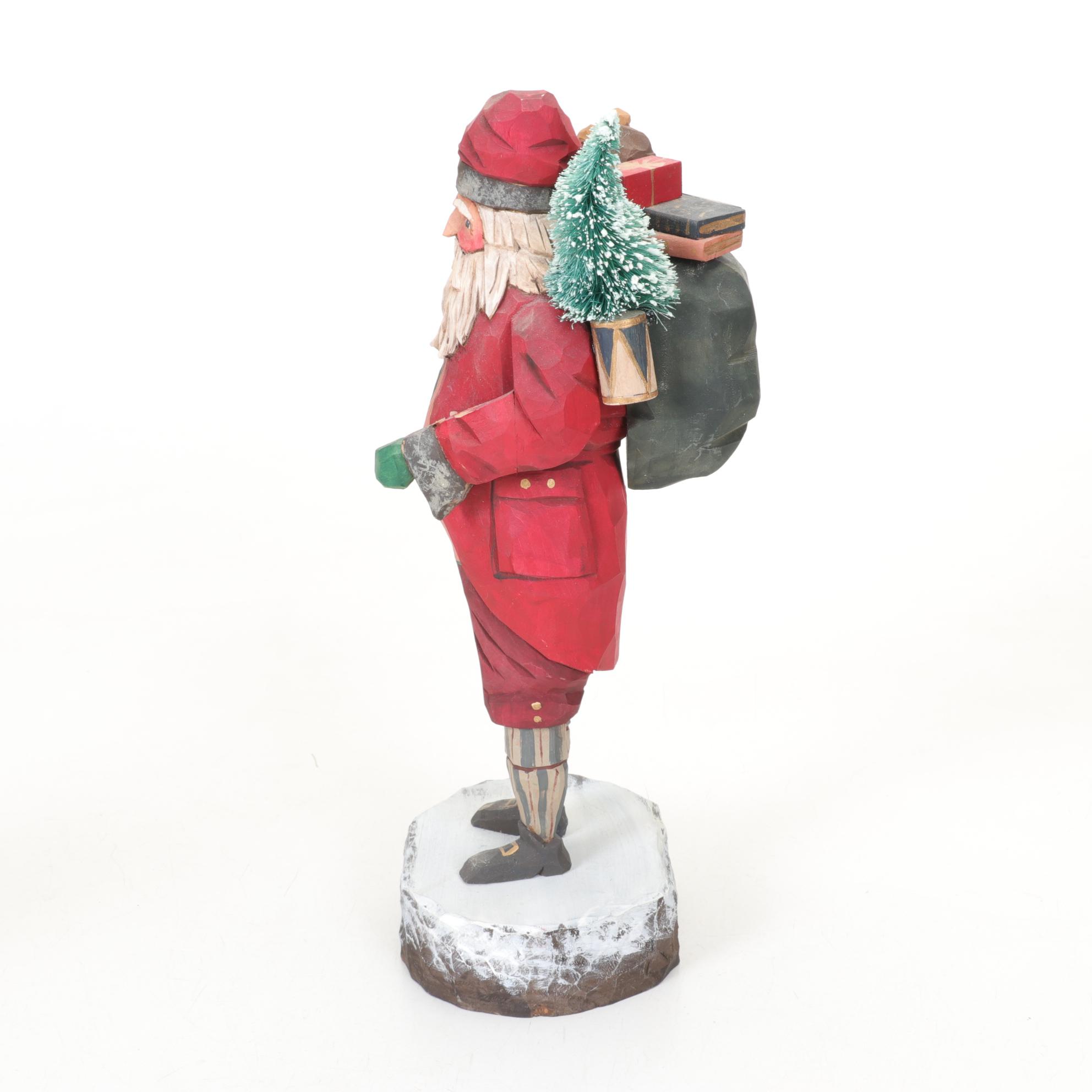 Carved Wood and Hand-Painted Folk Art Santa Figurines Including Rawson