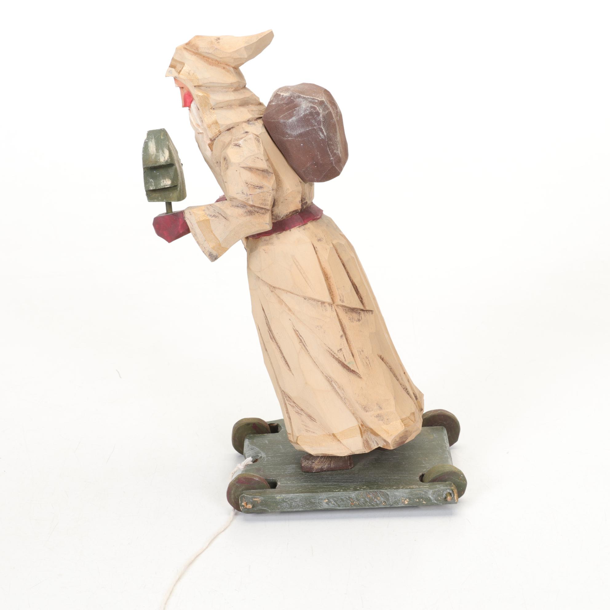 Carved Wood and Hand-Painted Folk Art Santa Figurines Including Rawson