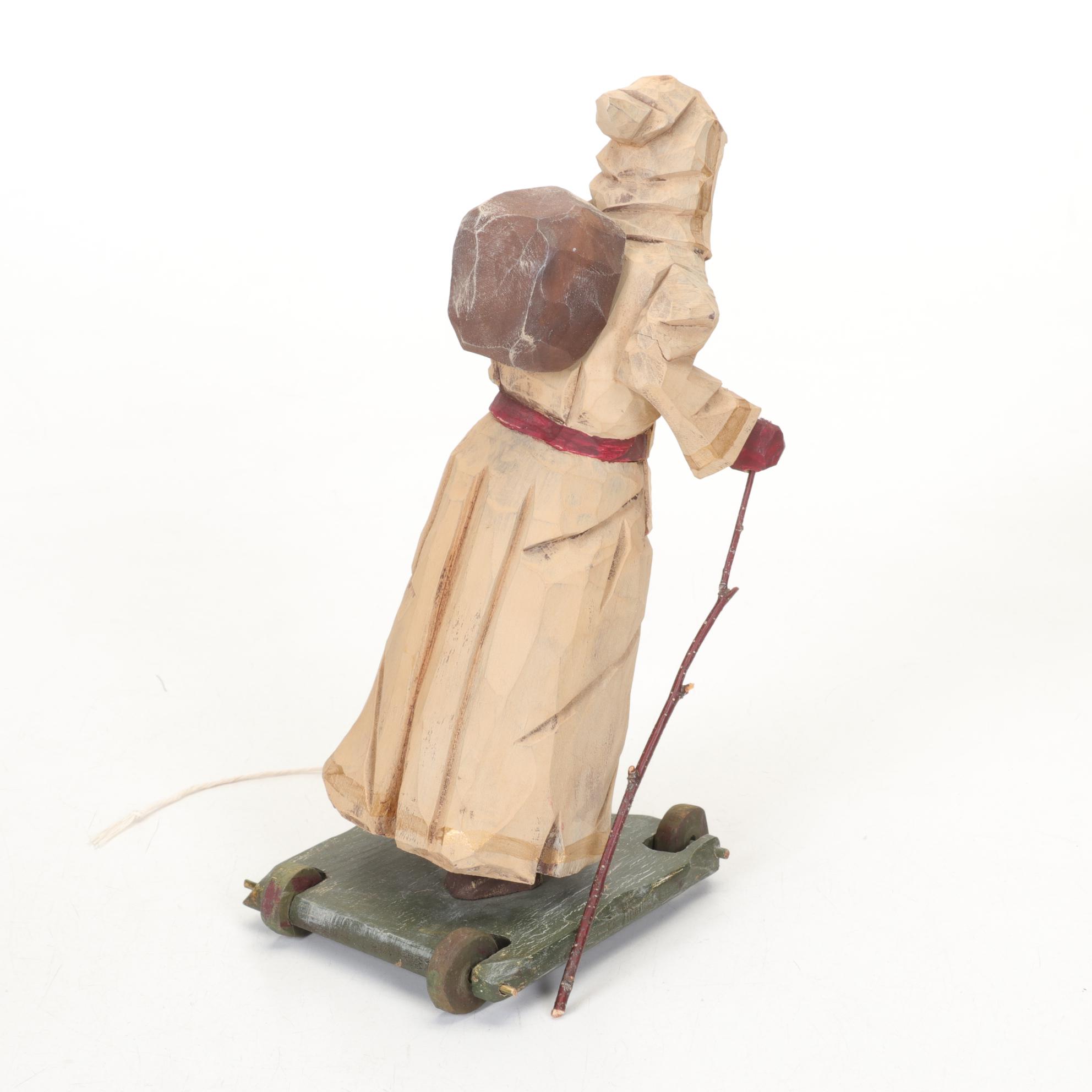 Carved Wood and Hand-Painted Folk Art Santa Figurines Including Rawson