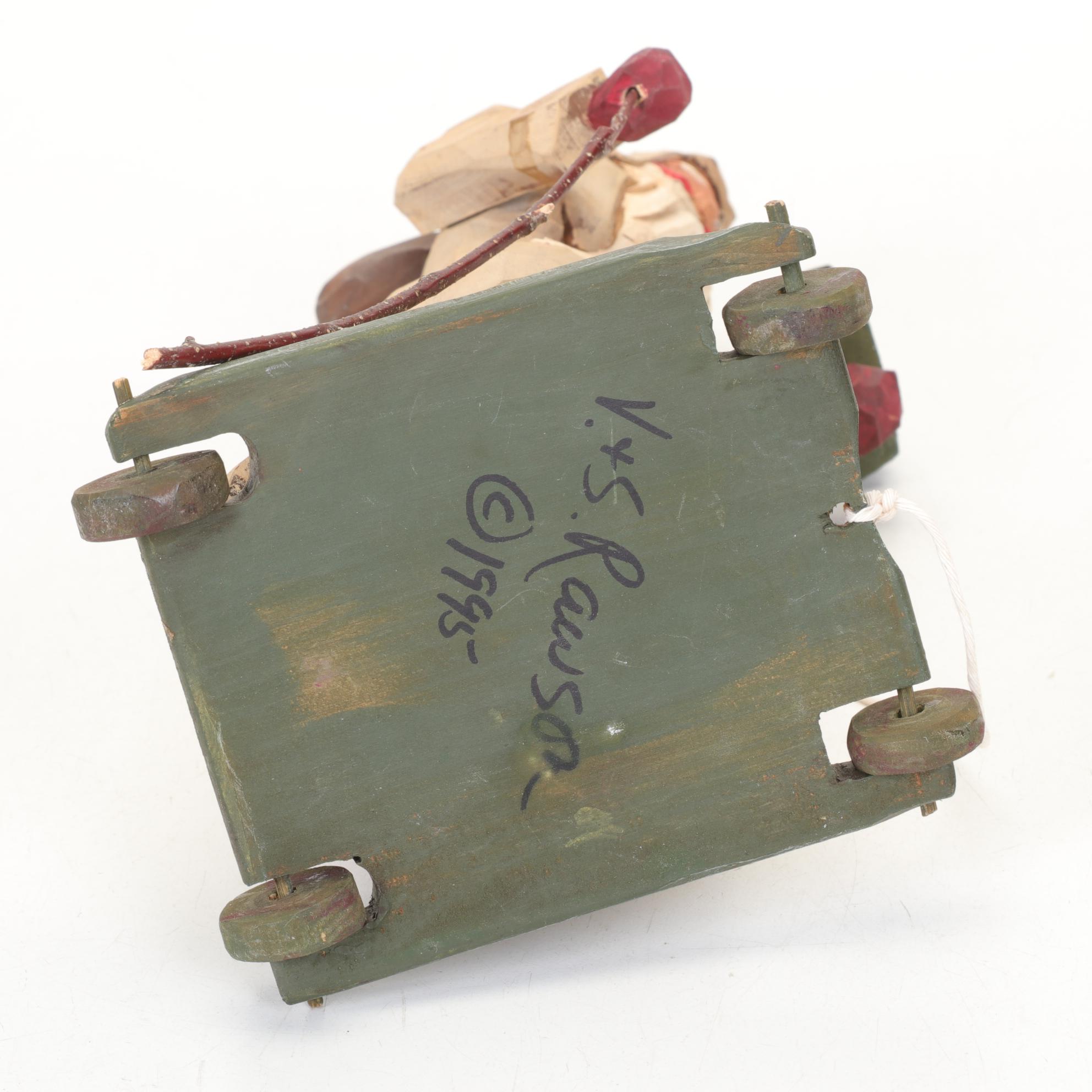 Carved Wood and Hand-Painted Folk Art Santa Figurines Including Rawson