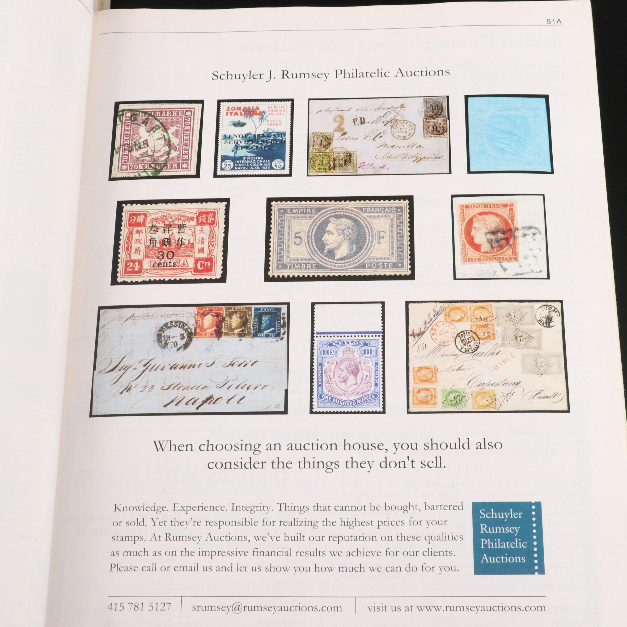 Assortment of World and U.S. Postage Stamps, Price Guide, and Binder