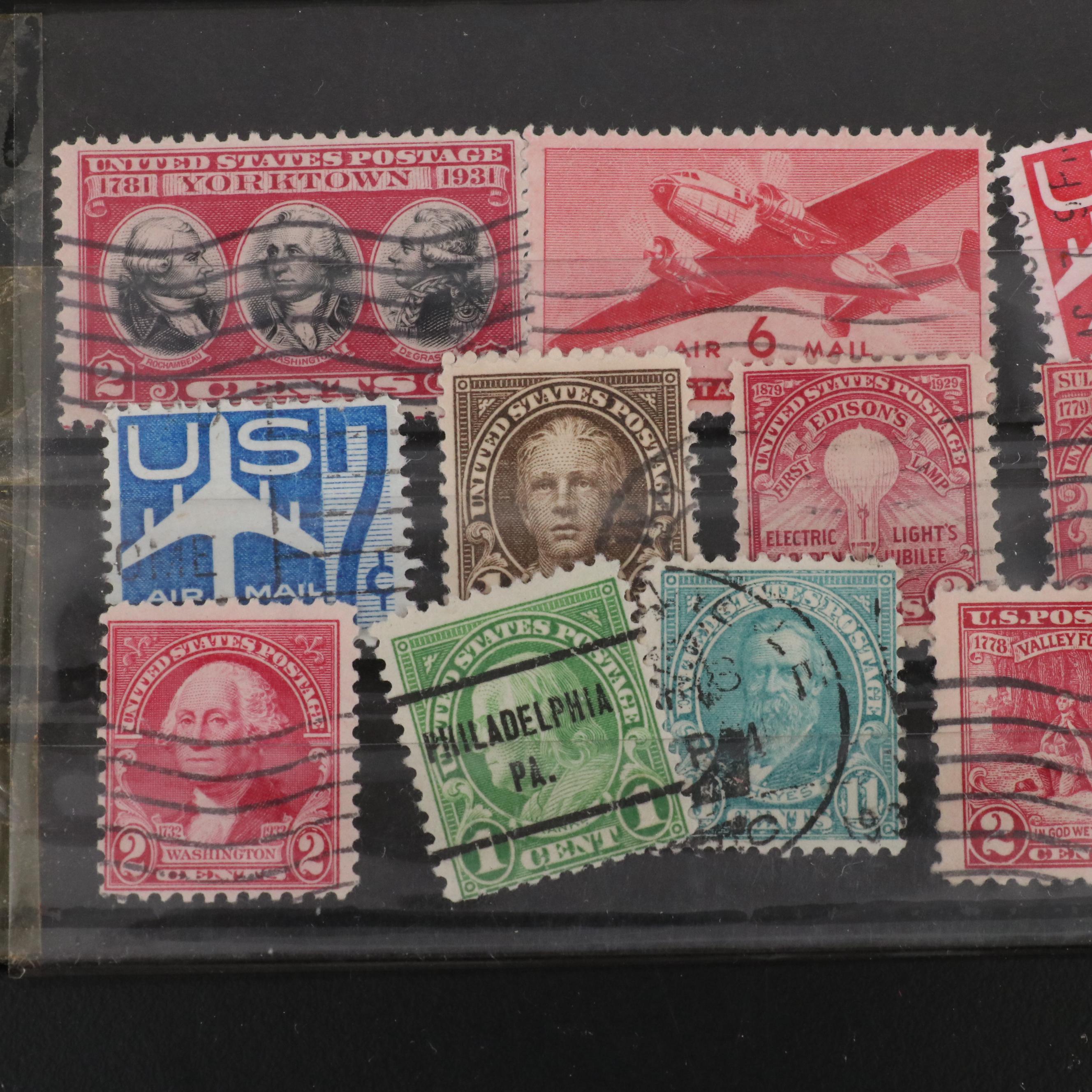 Assortment of World and U.S. Postage Stamps, Price Guide, and Binder