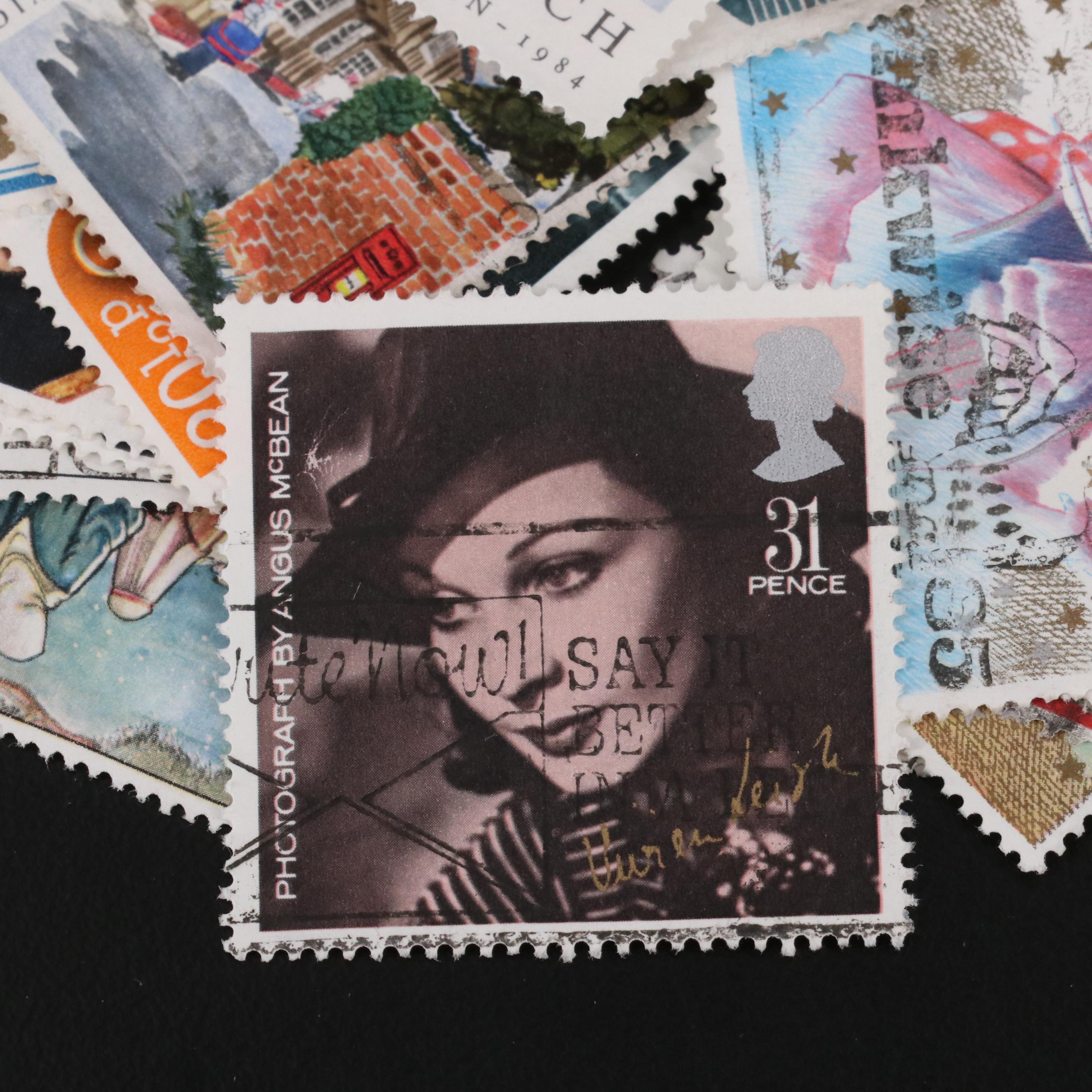 Assortment of World and U.S. Postage Stamps, Price Guide, and Binder