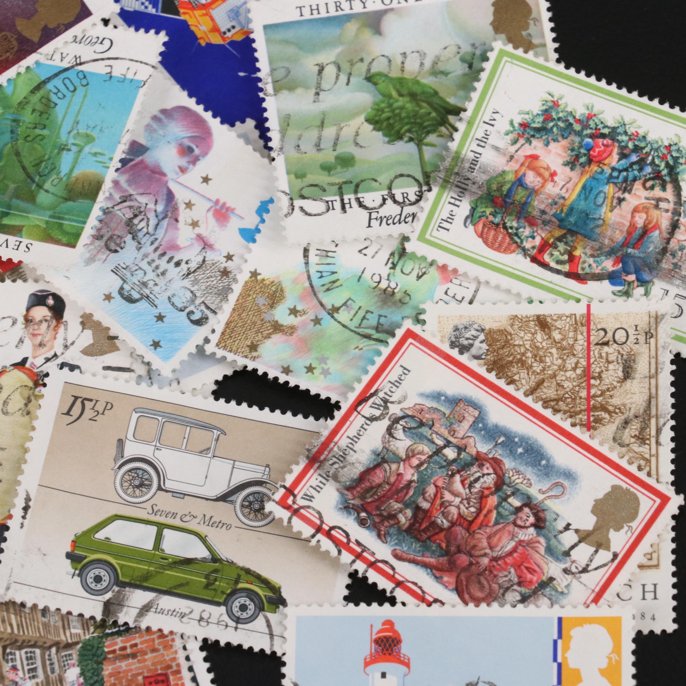 Assortment of World and U.S. Postage Stamps, Price Guide, and Binder