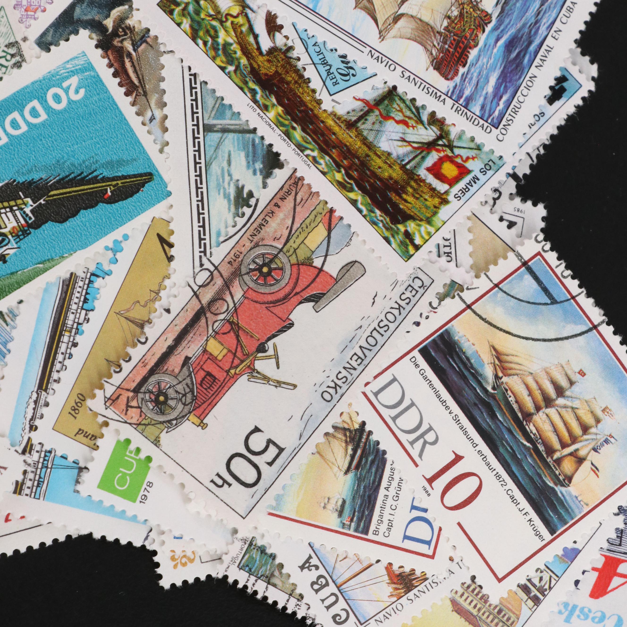 Assortment of World and U.S. Postage Stamps, Price Guide, and Binder