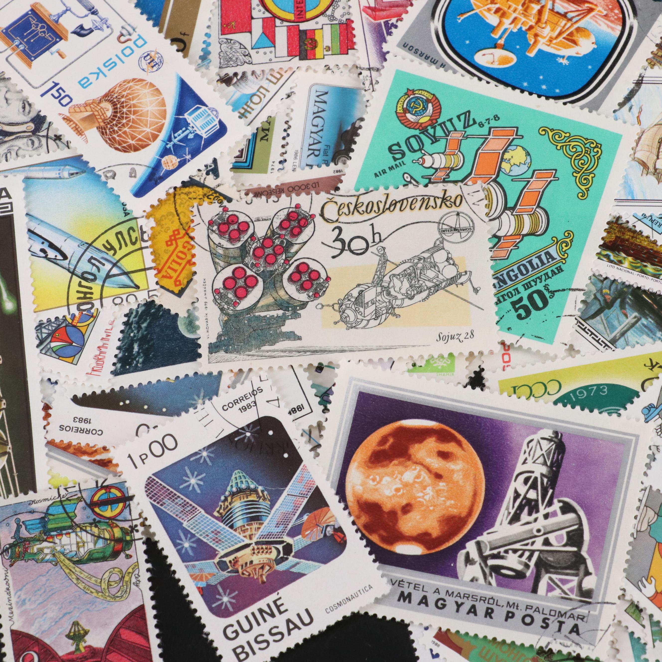 Assortment of World and U.S. Postage Stamps, Price Guide, and Binder