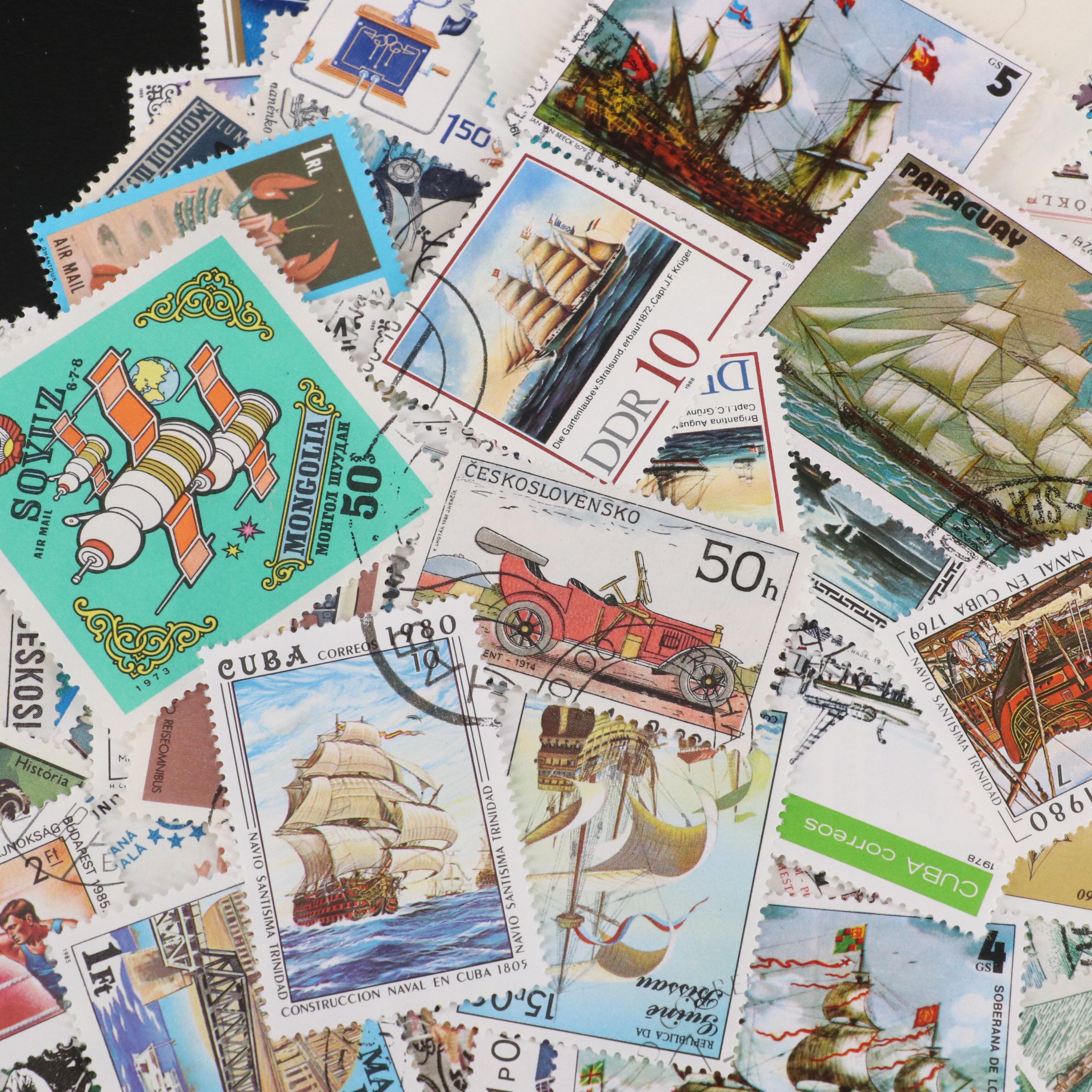 Assortment of World and U.S. Postage Stamps, Price Guide, and Binder