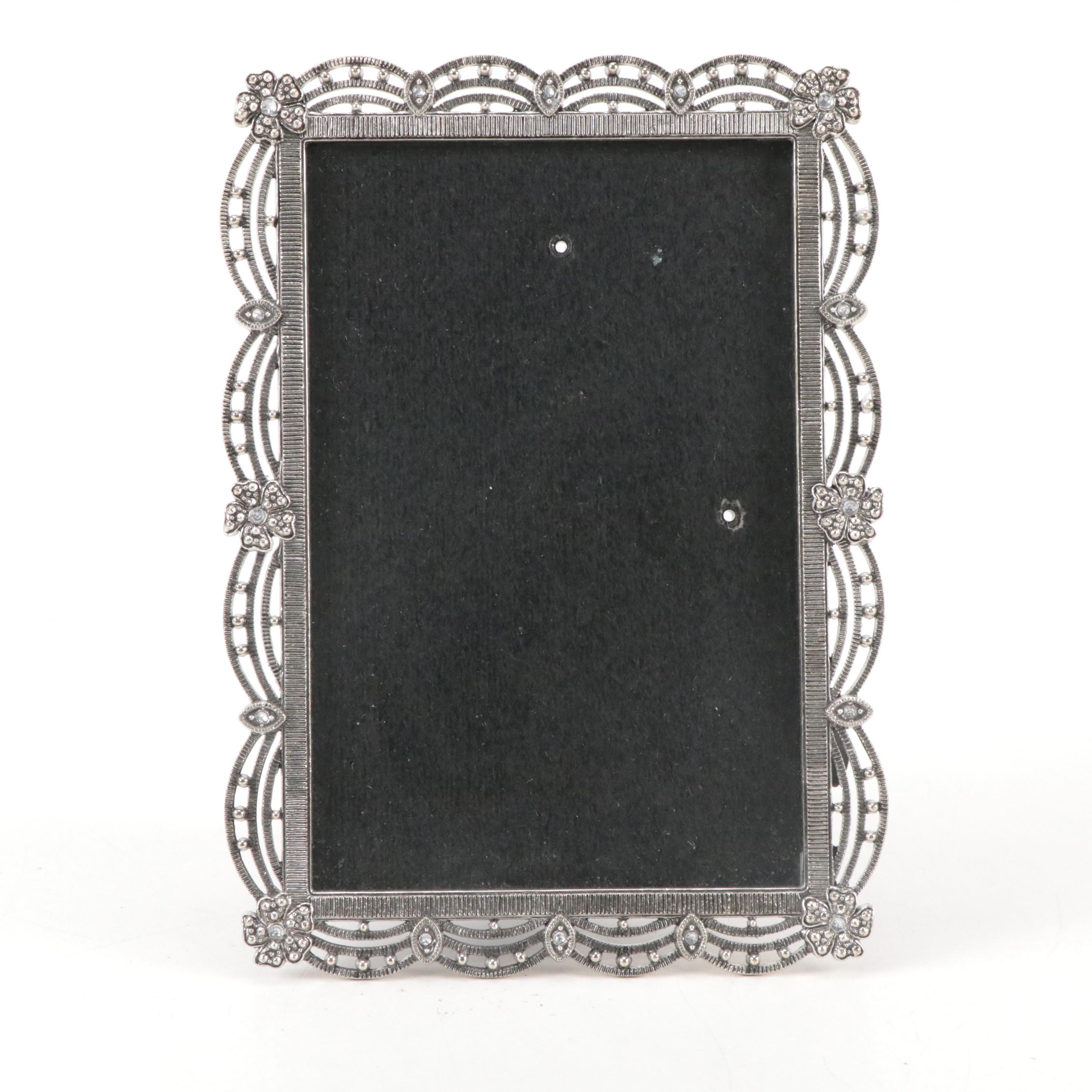 Mirrored Vanity Tray with Embossed Lidded Jars and Brass Candlesticks, 20th C.