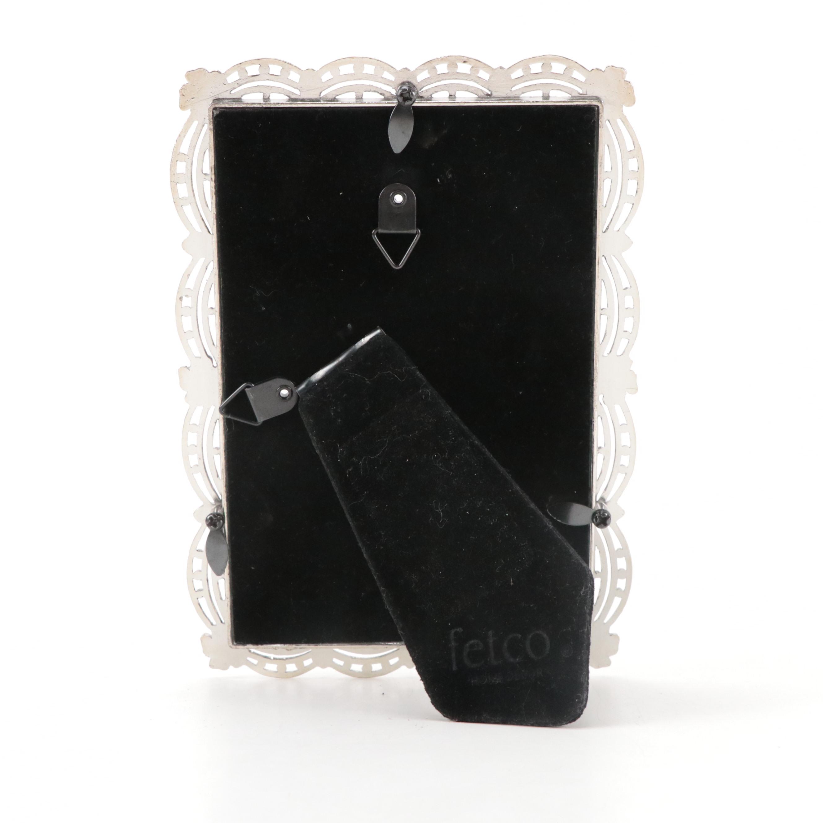 Mirrored Vanity Tray with Embossed Lidded Jars and Brass Candlesticks, 20th C.