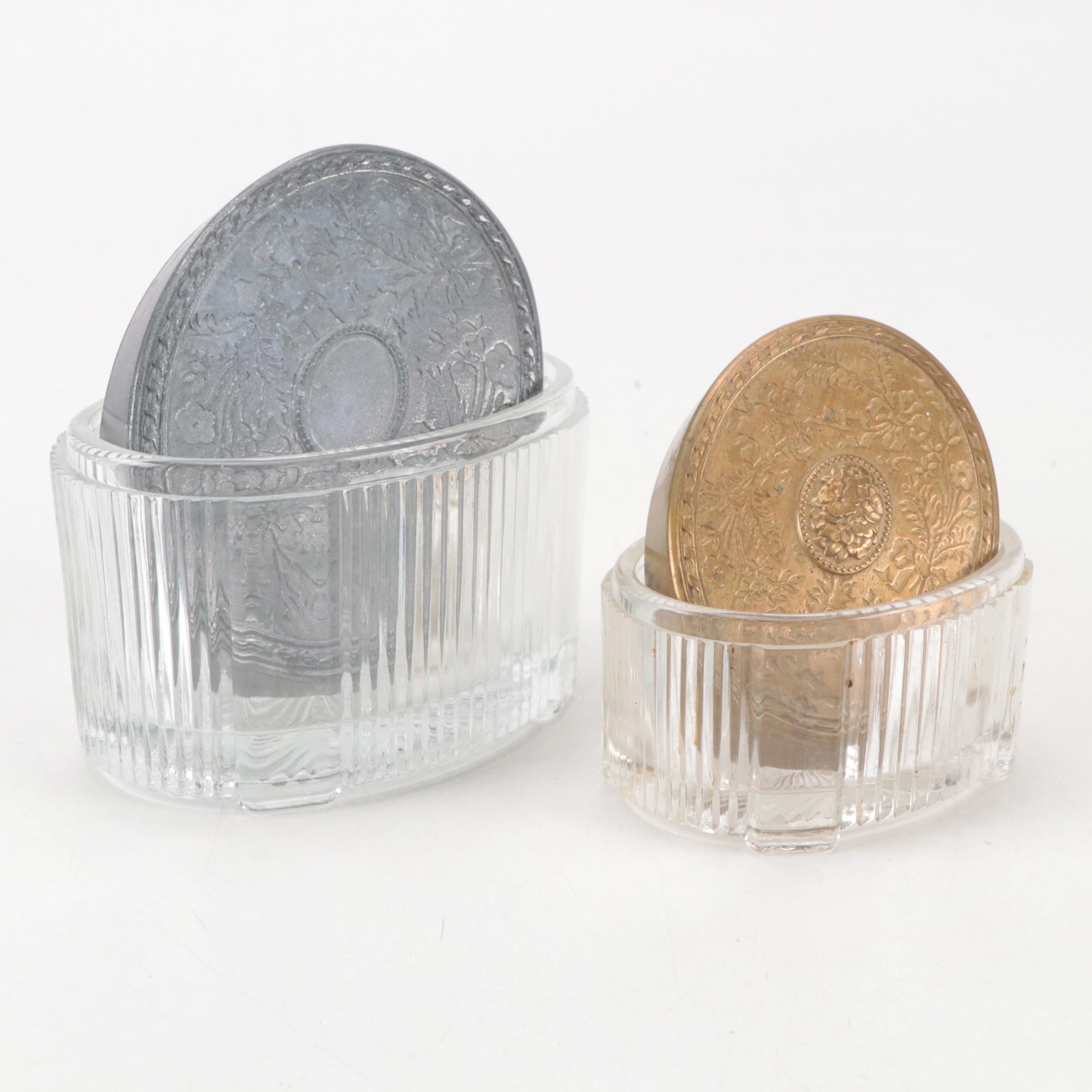 Mirrored Vanity Tray with Embossed Lidded Jars and Brass Candlesticks, 20th C.