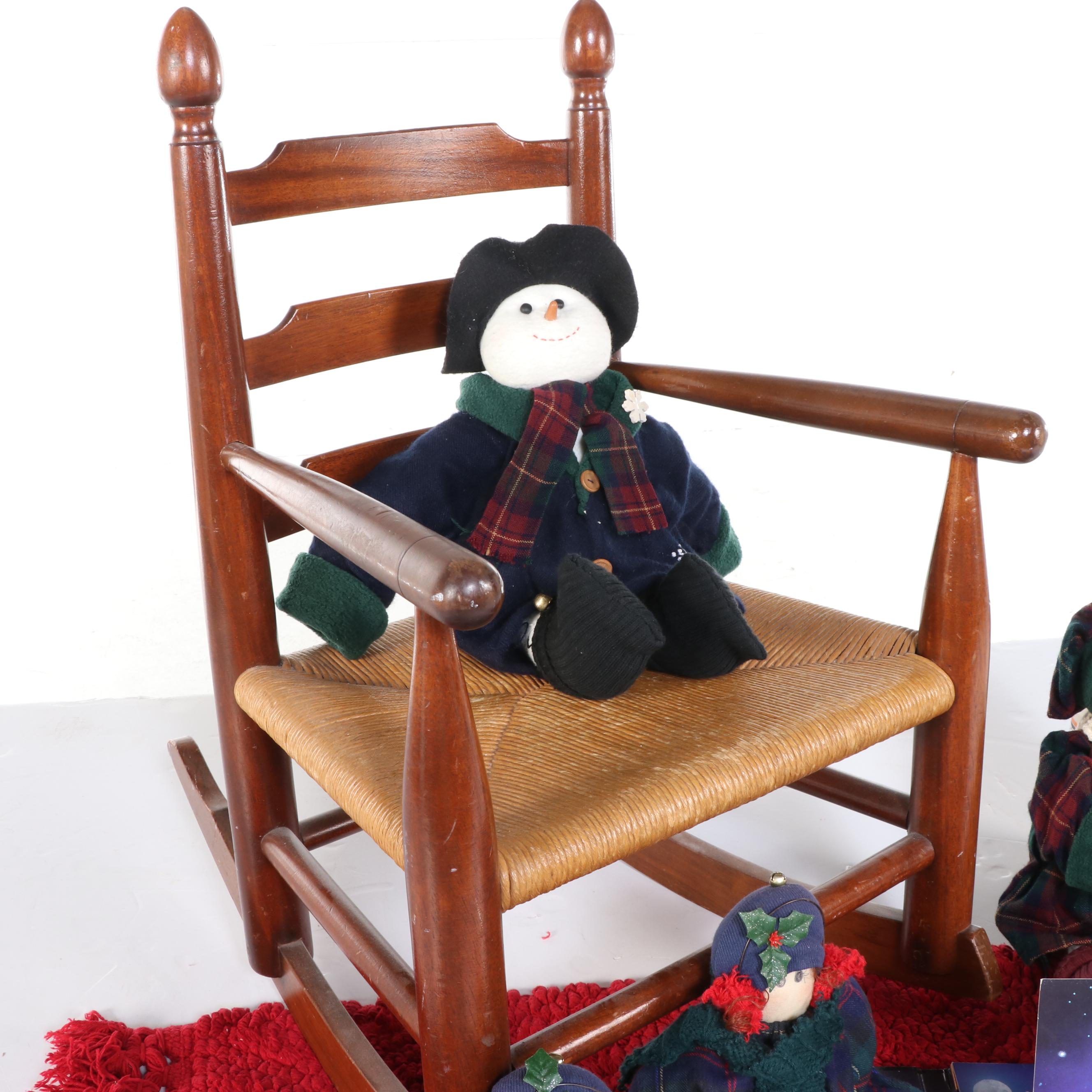 Child-Sized Wood Rocking Chair, Accent Rug, Snowmen Plushes, and Pop-Up Book