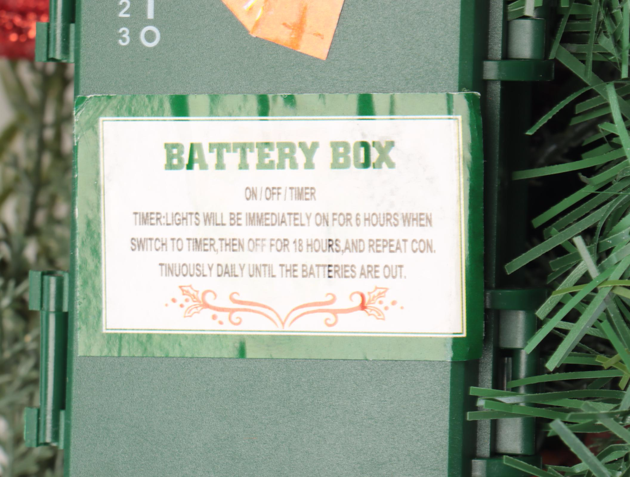 Red Candle Lantern and Artificial Christmas Wreath