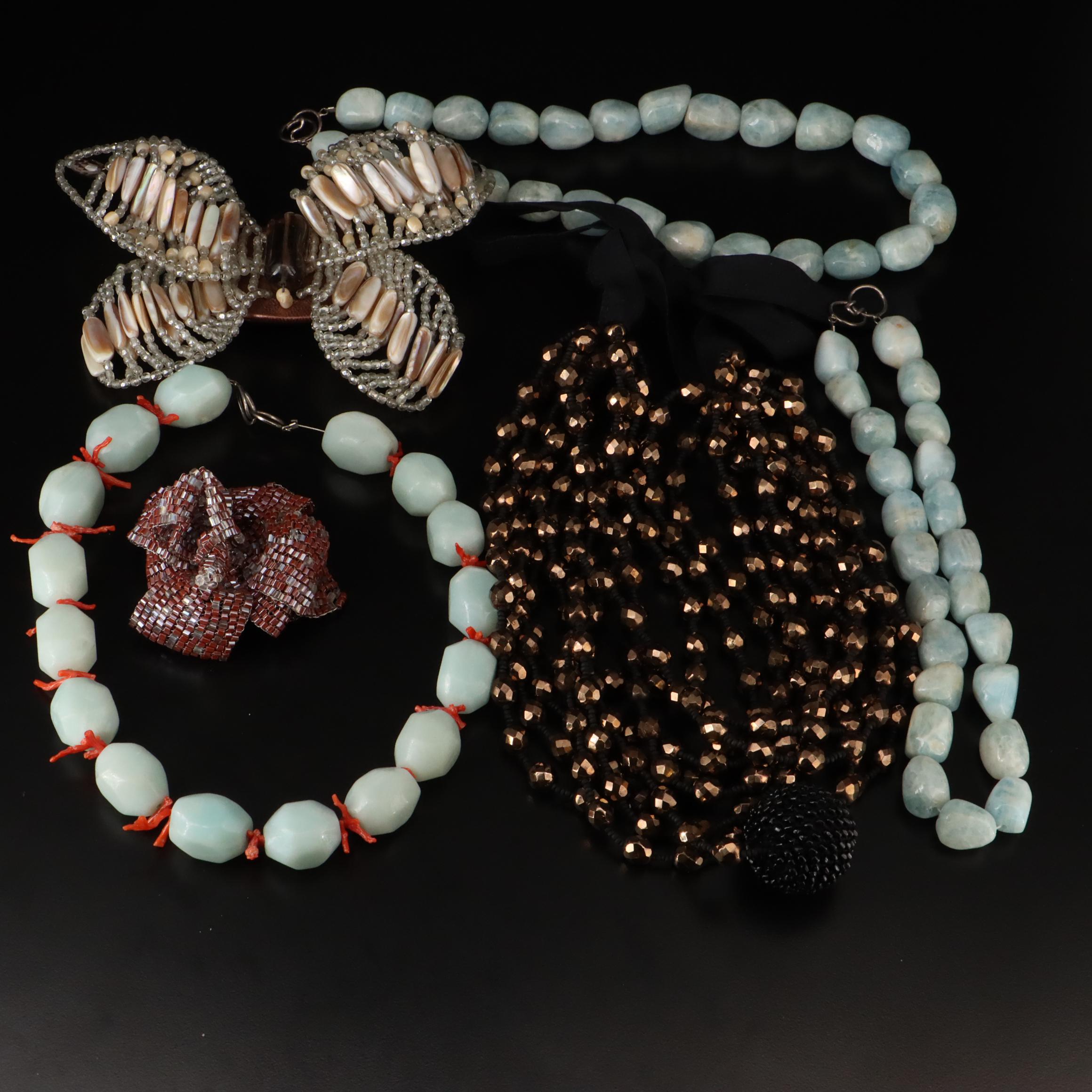 Necklaces and Brooches Including Sterling with Smoky Quartz, Glass and Coral