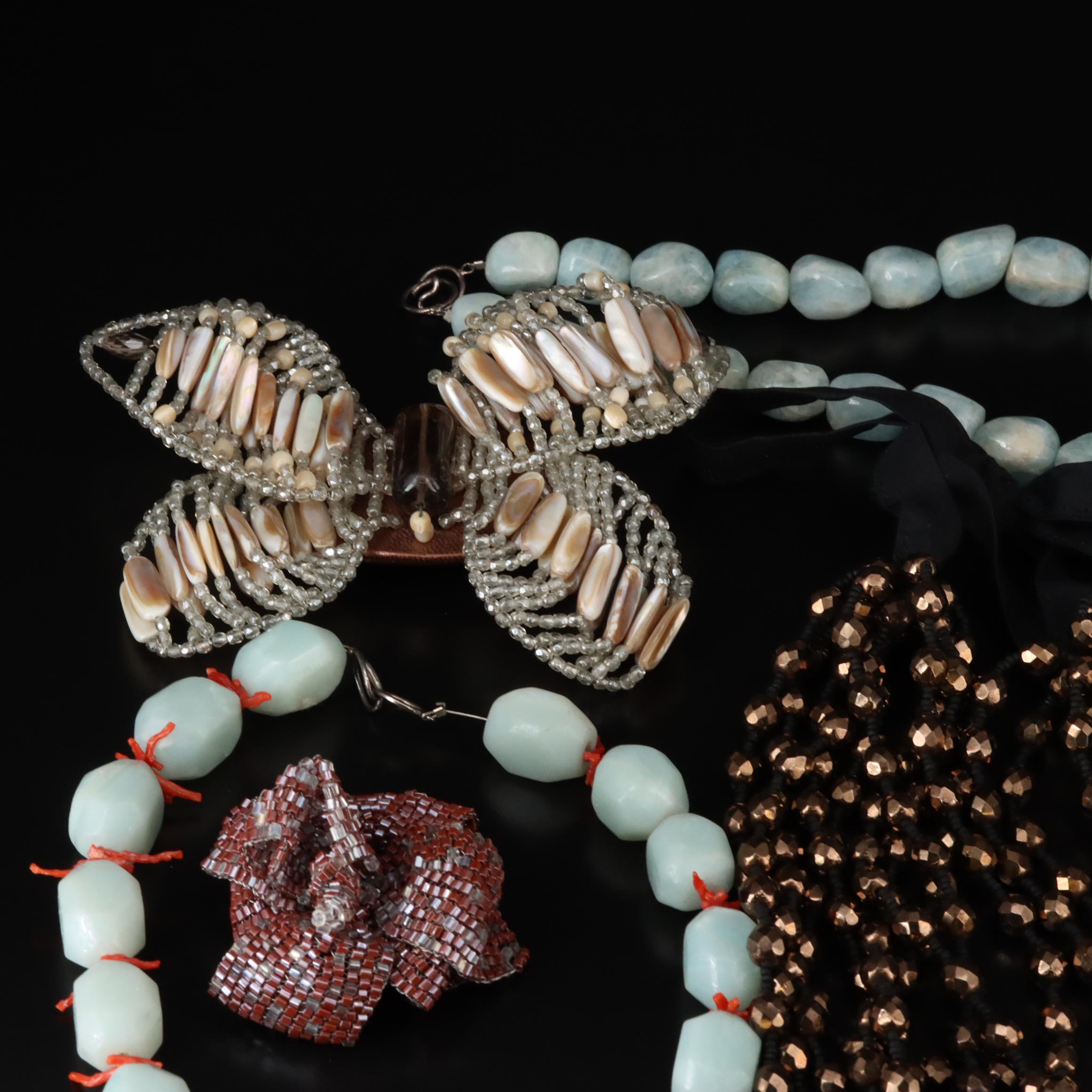 Necklaces and Brooches Including Sterling with Smoky Quartz, Glass and Coral