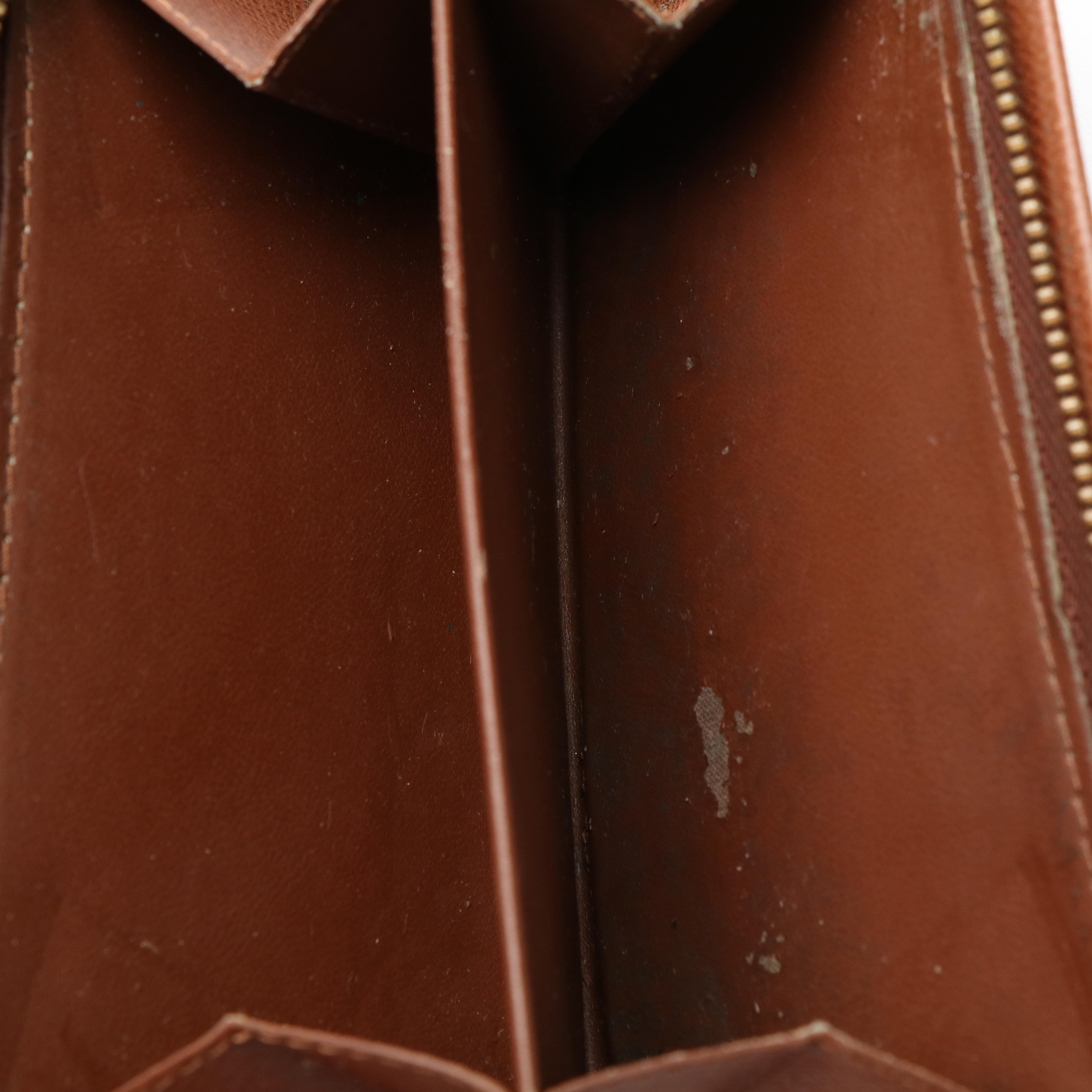 Louis Vuitton Porte Tresor Wallet in Monogram Coated Canvas