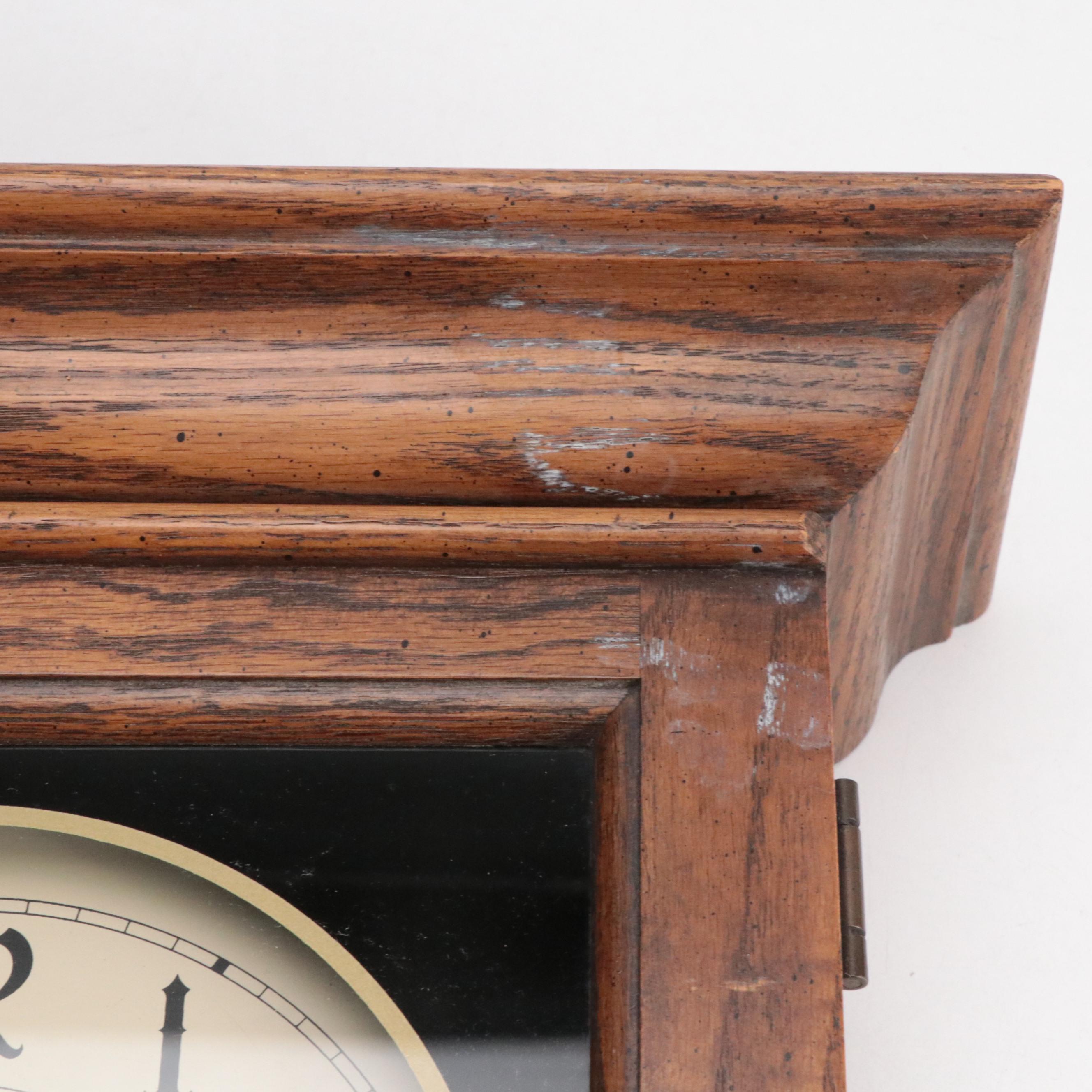 Howard Miller Oak Case Regulator Wall Clock