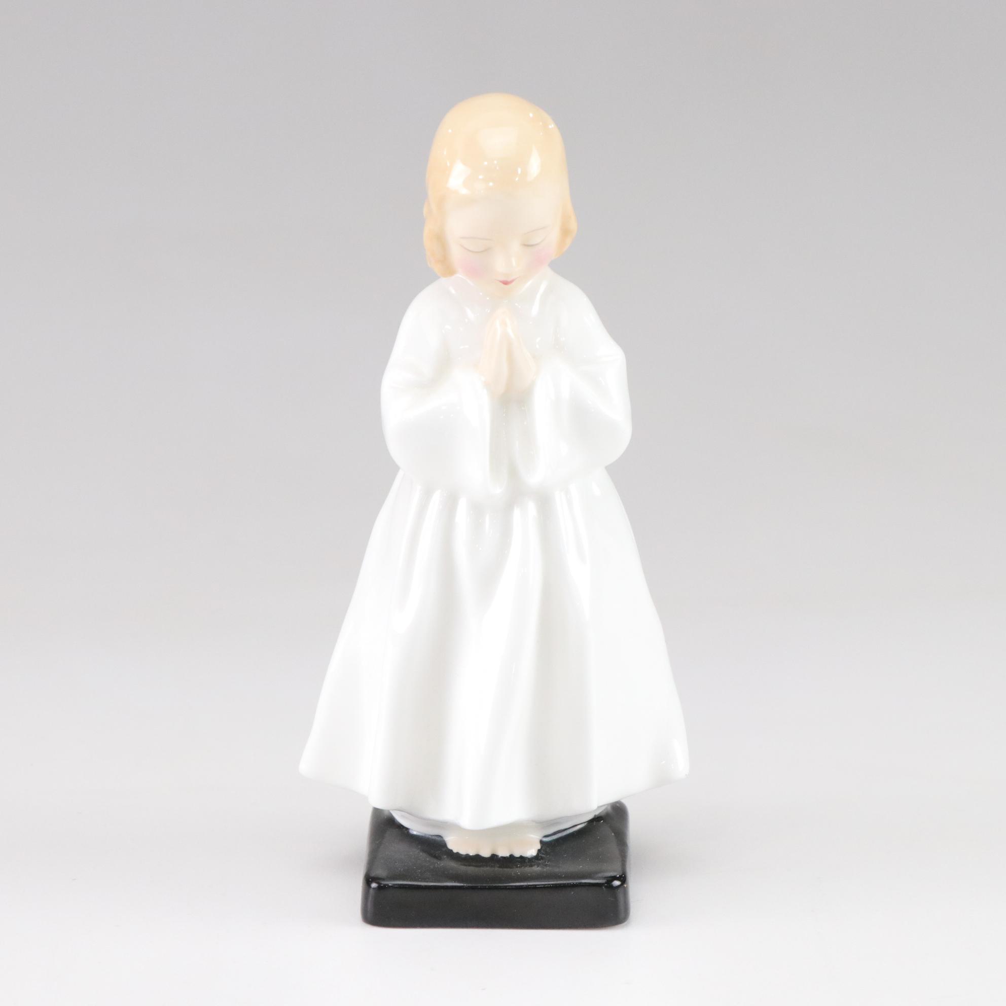 Lladró "Puzzled Cherub" and Royal Doulton "Bedtime" Figurines