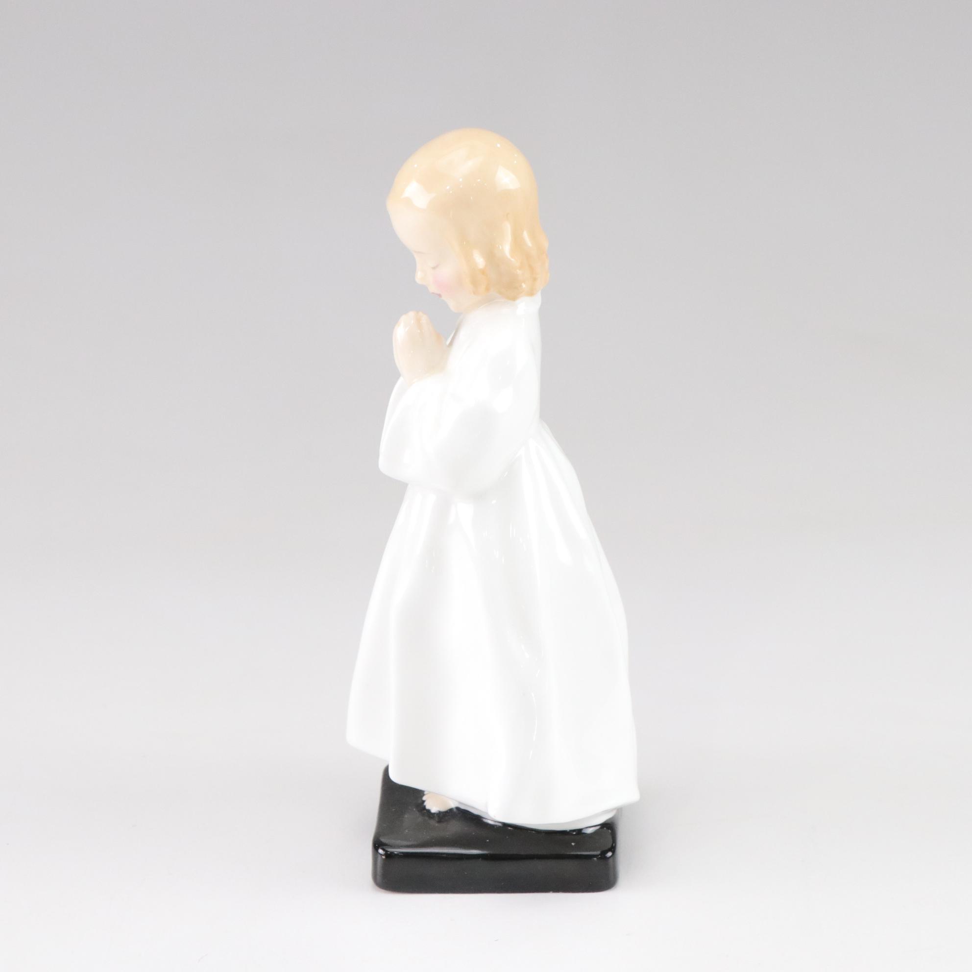 Lladró "Puzzled Cherub" and Royal Doulton "Bedtime" Figurines