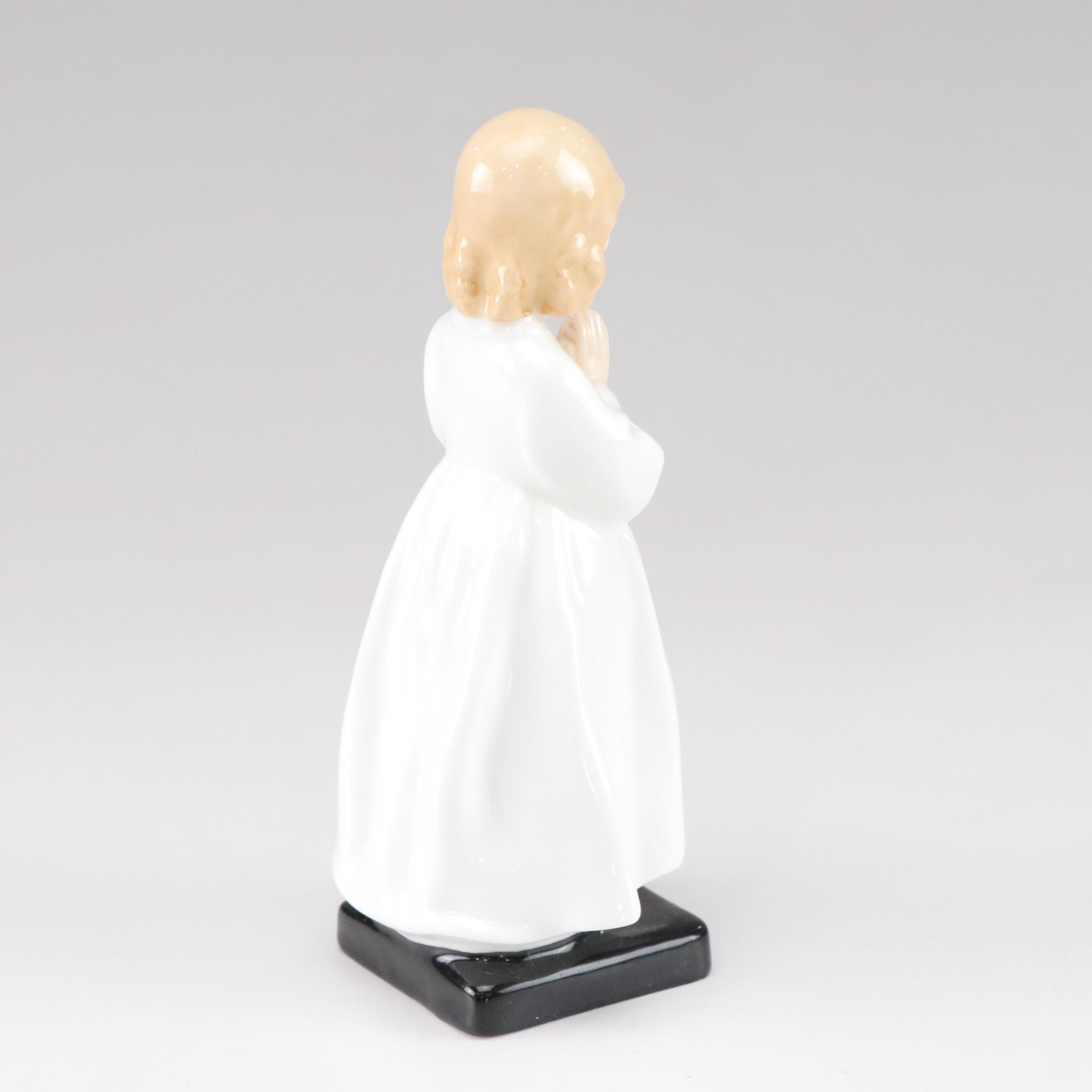 Lladró "Puzzled Cherub" and Royal Doulton "Bedtime" Figurines