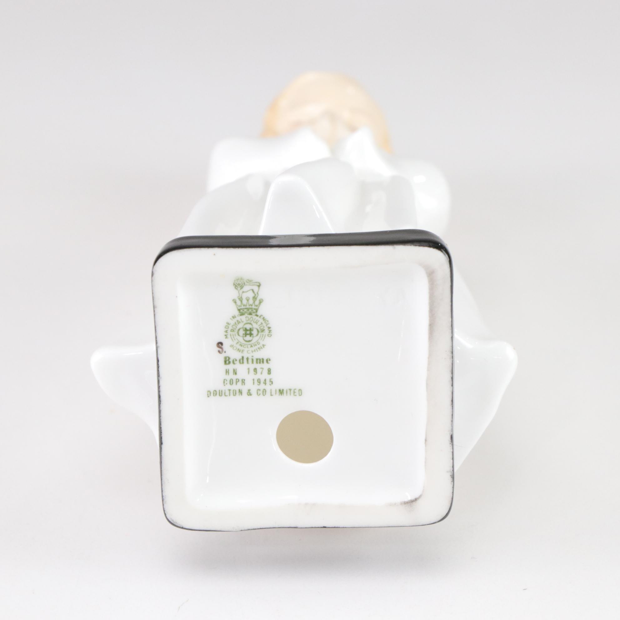 Lladró "Puzzled Cherub" and Royal Doulton "Bedtime" Figurines