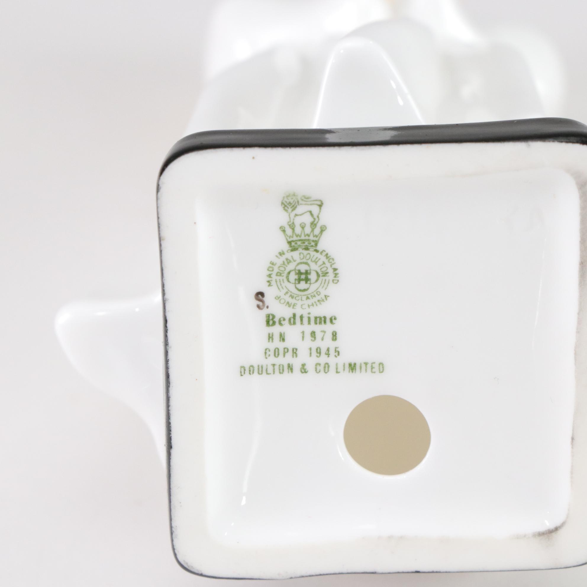 Lladró "Puzzled Cherub" and Royal Doulton "Bedtime" Figurines