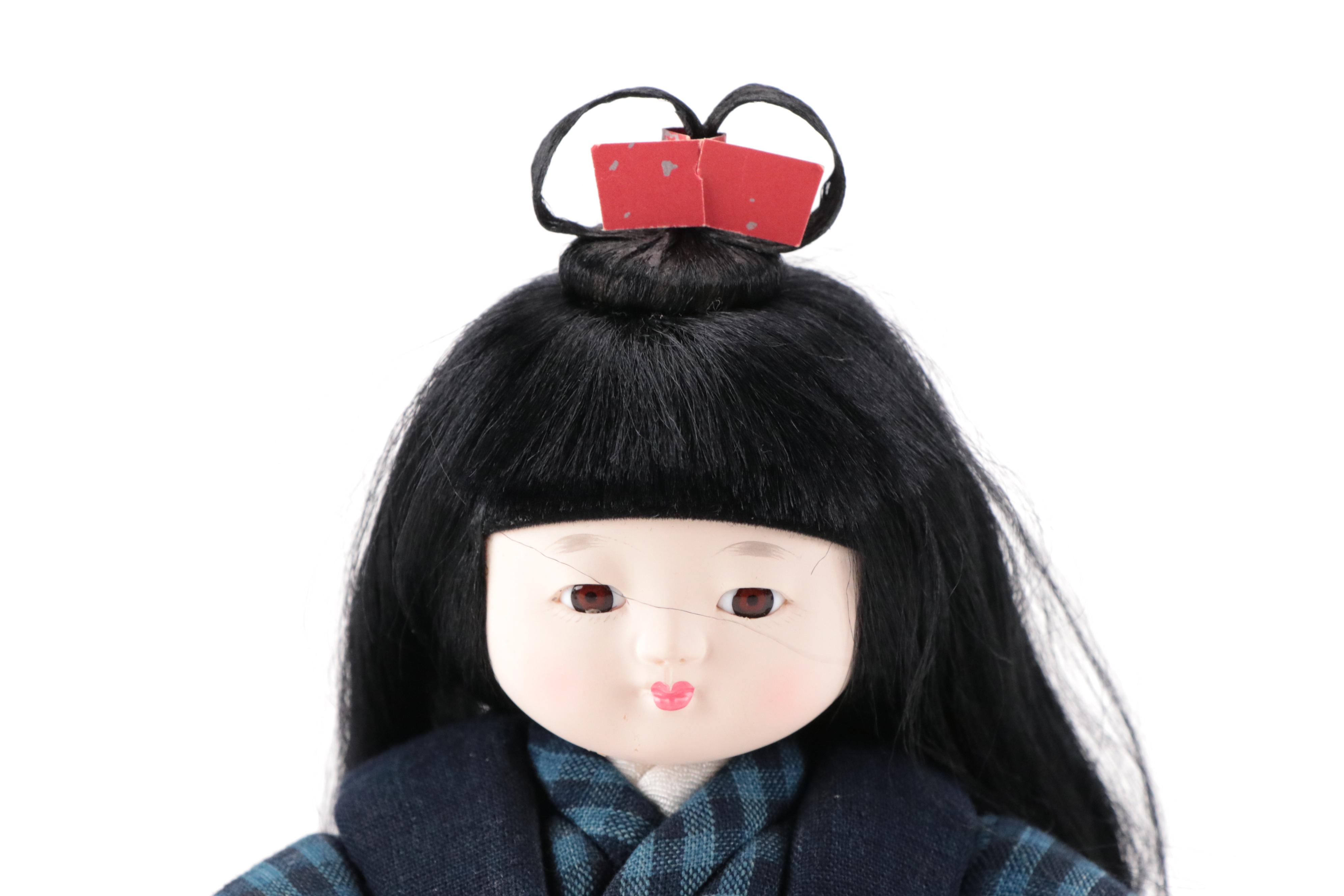 Pair of Japanese Dolls in Matsusaka Momen Clothing with Wooden Bases and Booklet