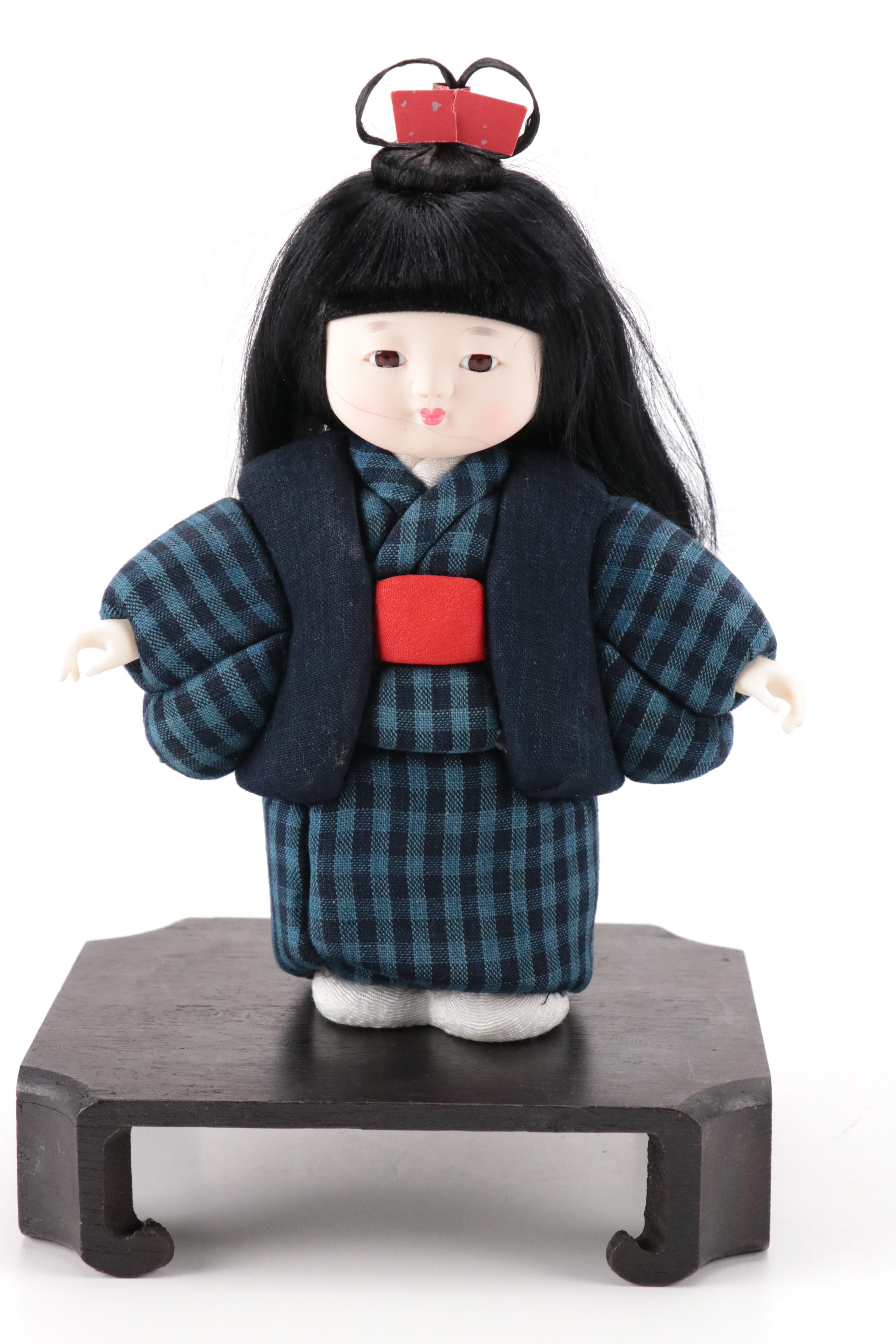 Pair of Japanese Dolls in Matsusaka Momen Clothing with Wooden Bases and Booklet