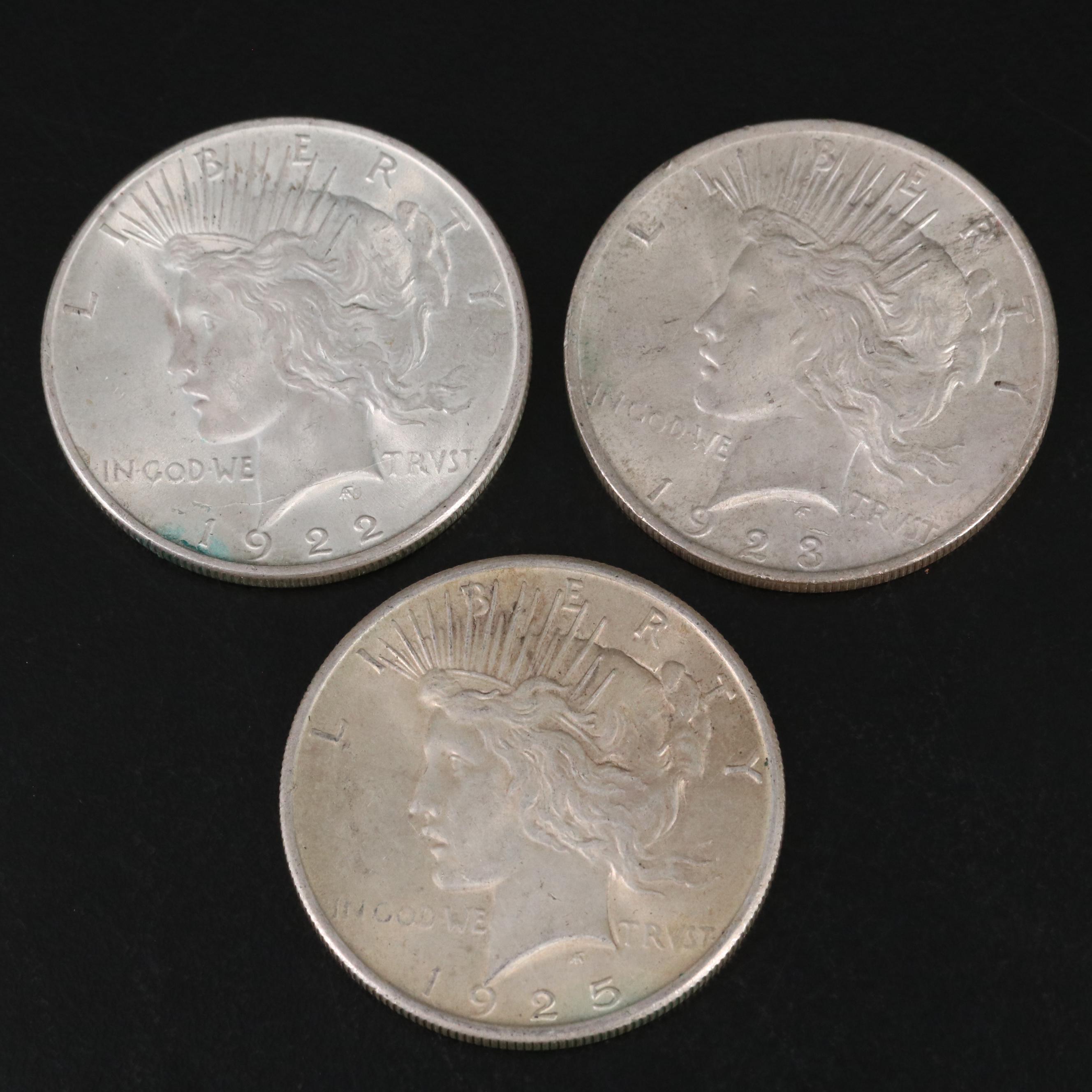 Three Different United States Peace Dollars with a 1925