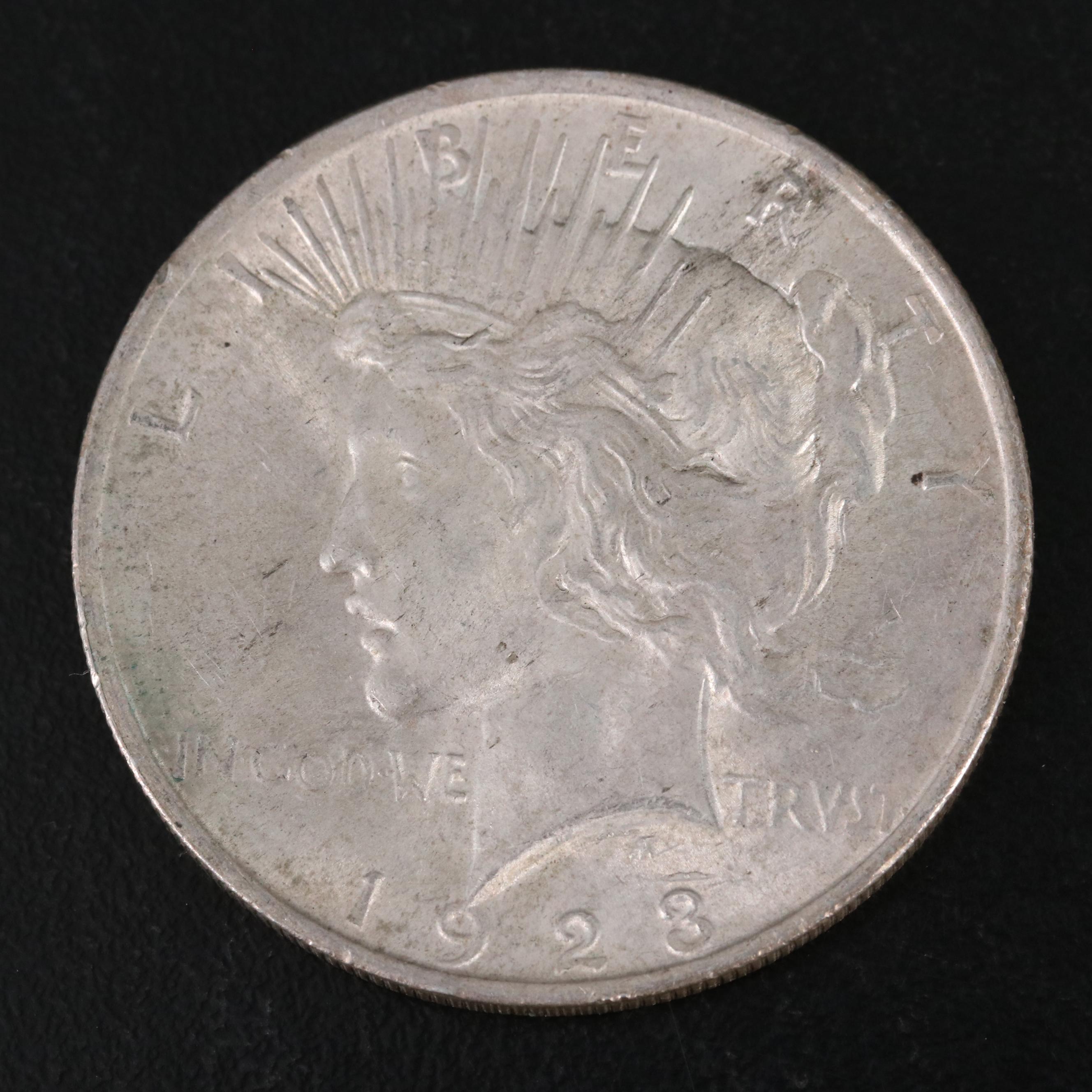 Three Different United States Peace Dollars with a 1925
