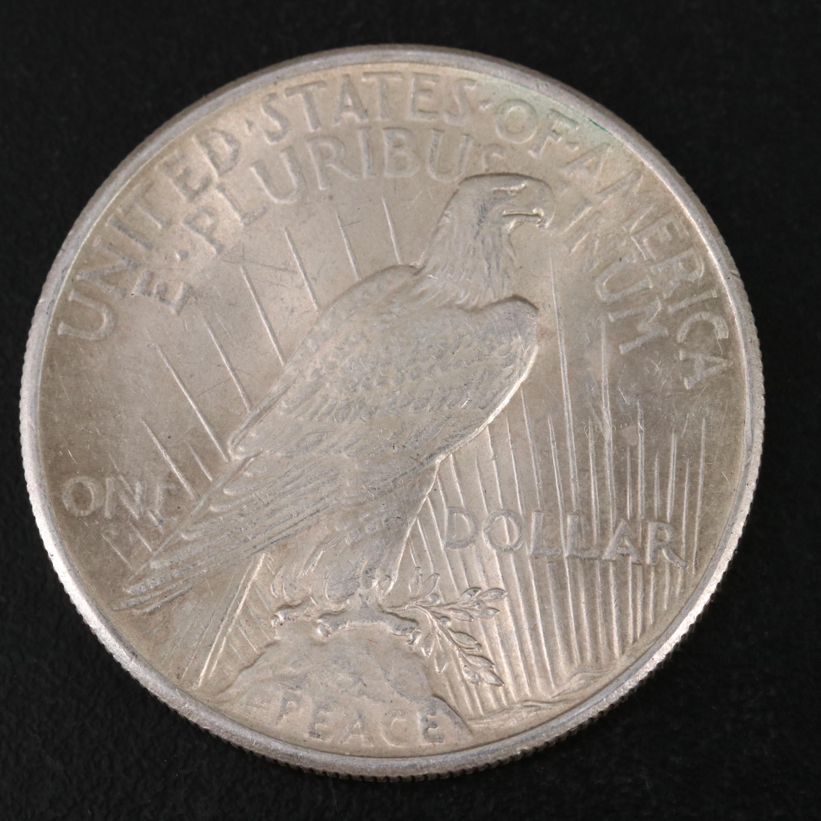 Three Different United States Peace Dollars with a 1925