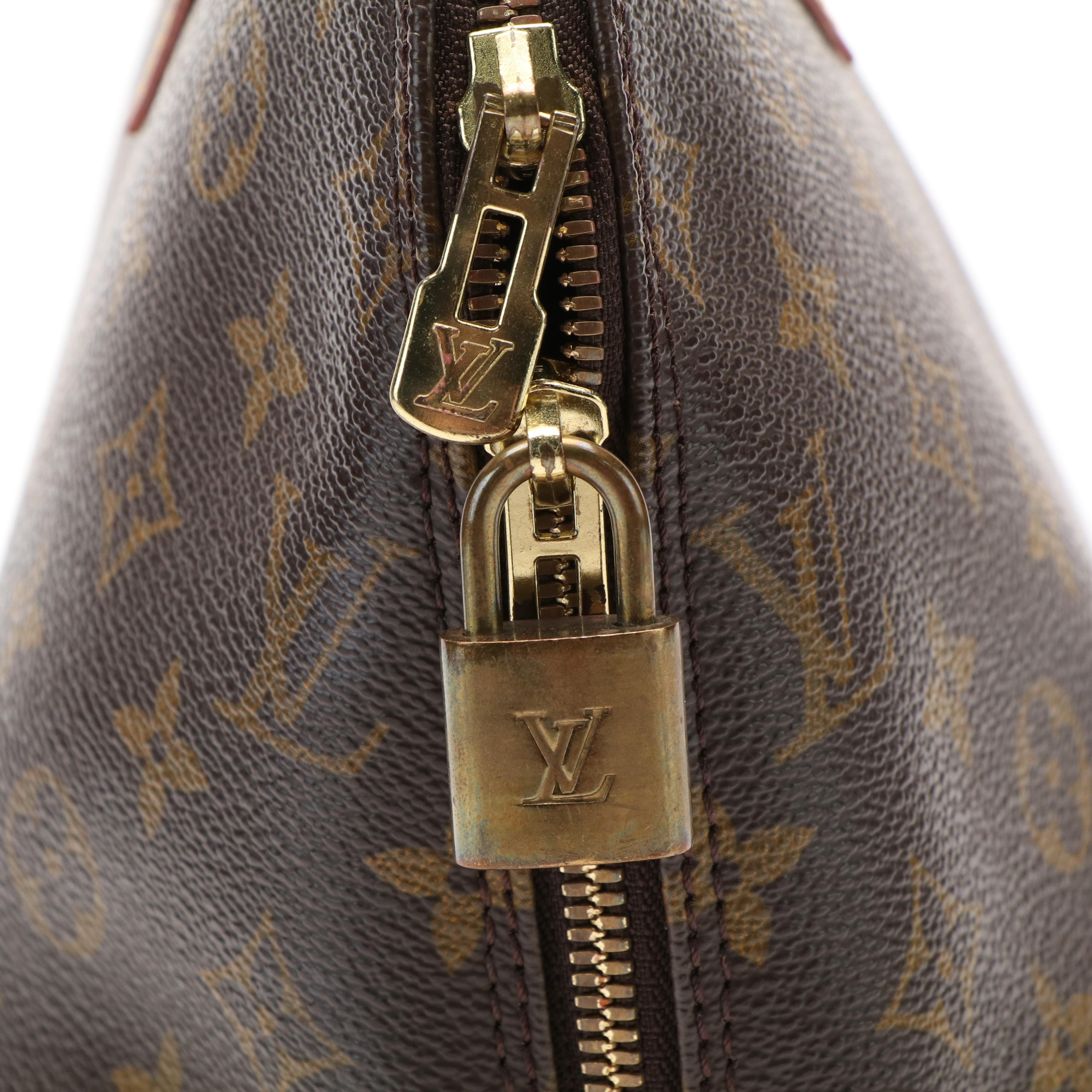 Louis Vuitton Alma PM Bag in Monogram Coated Canvas and Vachetta Leather