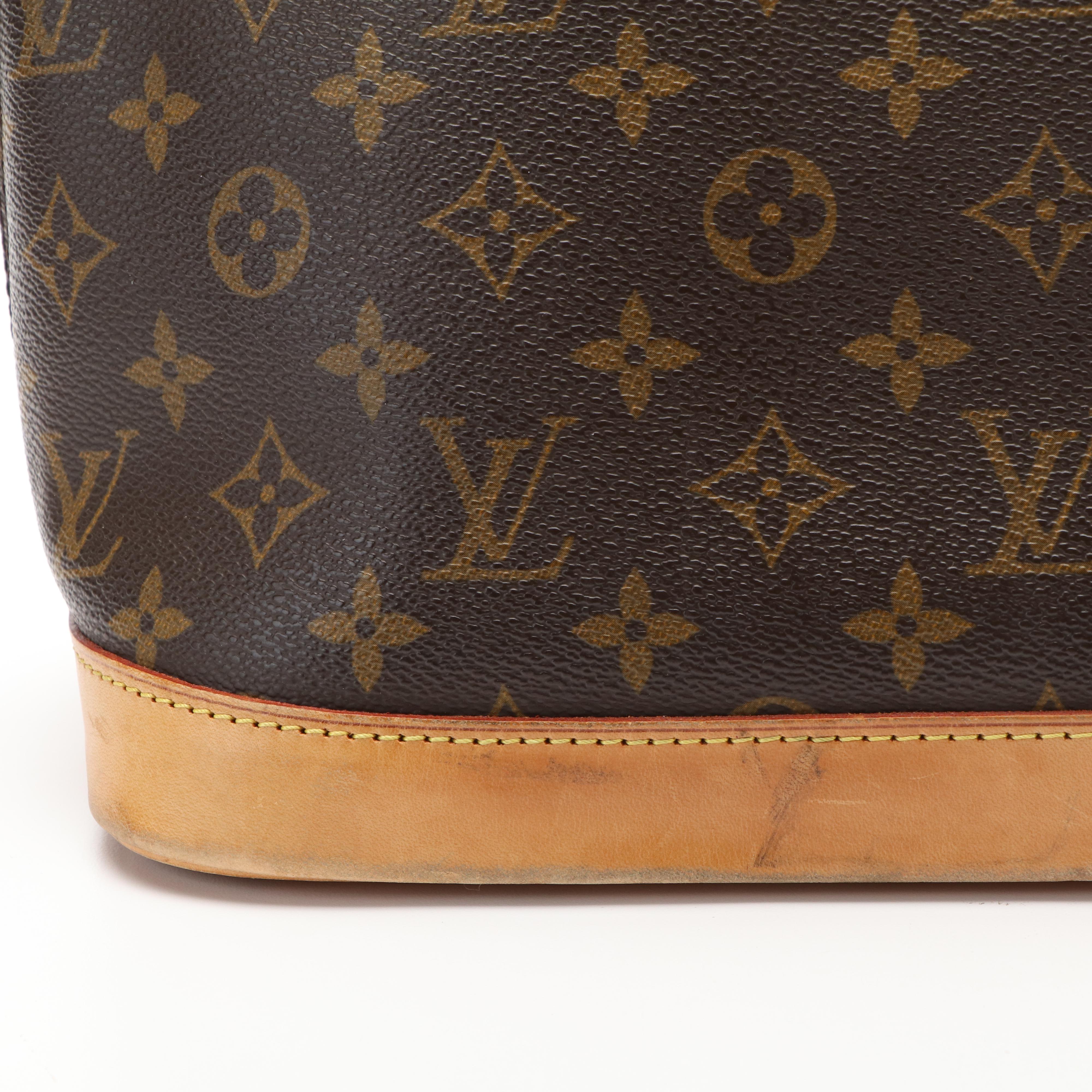 Louis Vuitton Alma PM Bag in Monogram Coated Canvas and Vachetta Leather