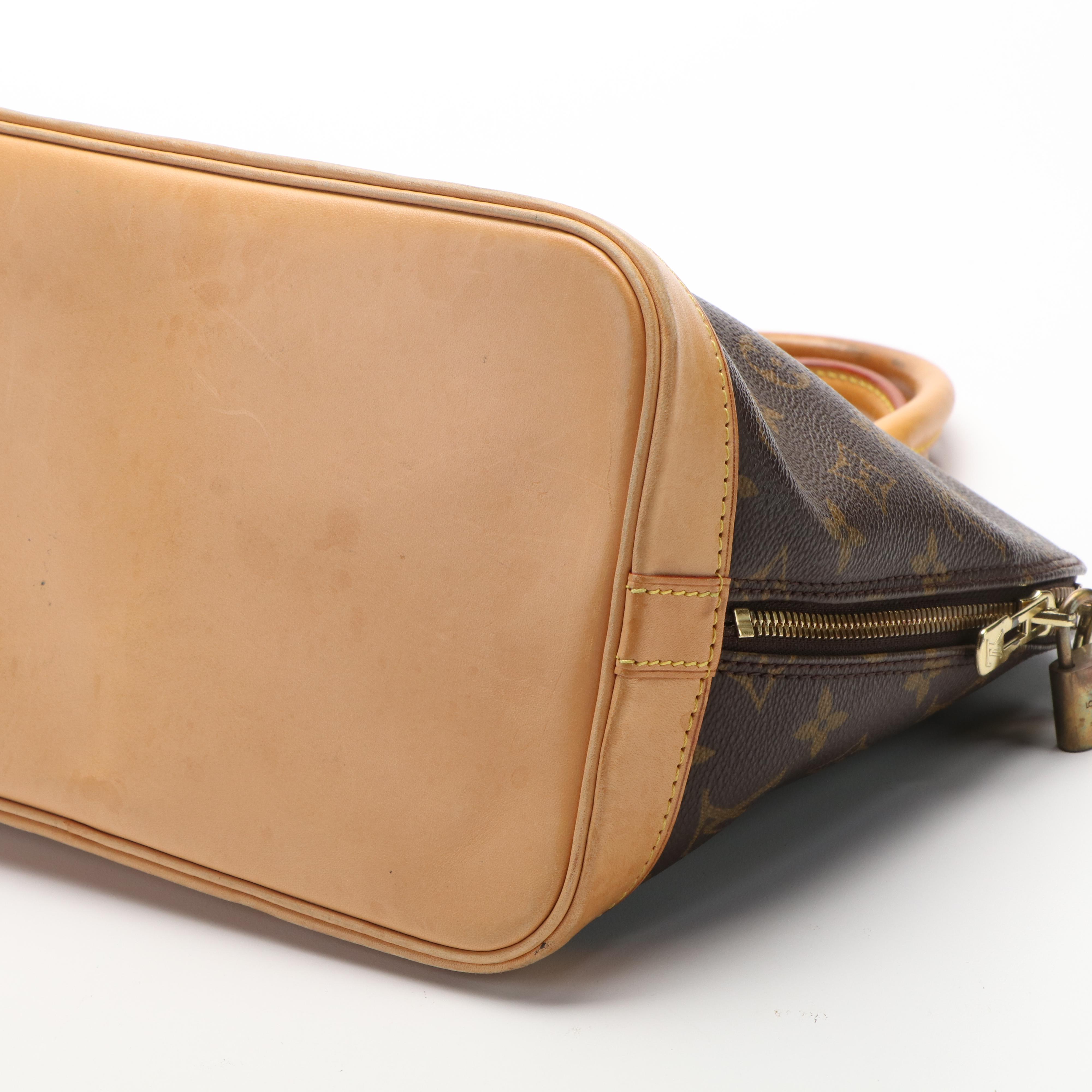 Louis Vuitton Alma PM Bag in Monogram Coated Canvas and Vachetta Leather