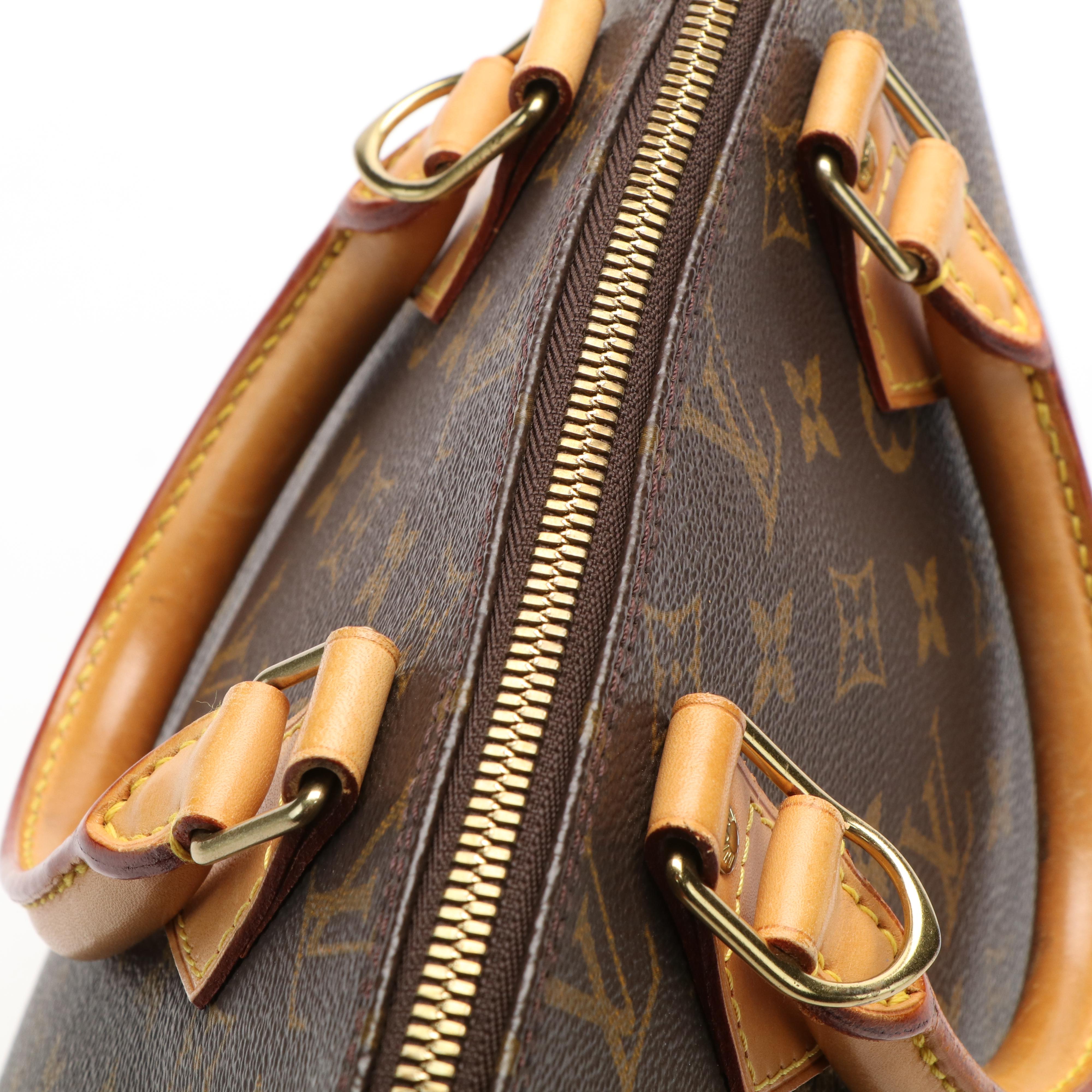 Louis Vuitton Alma PM Bag in Monogram Coated Canvas and Vachetta Leather