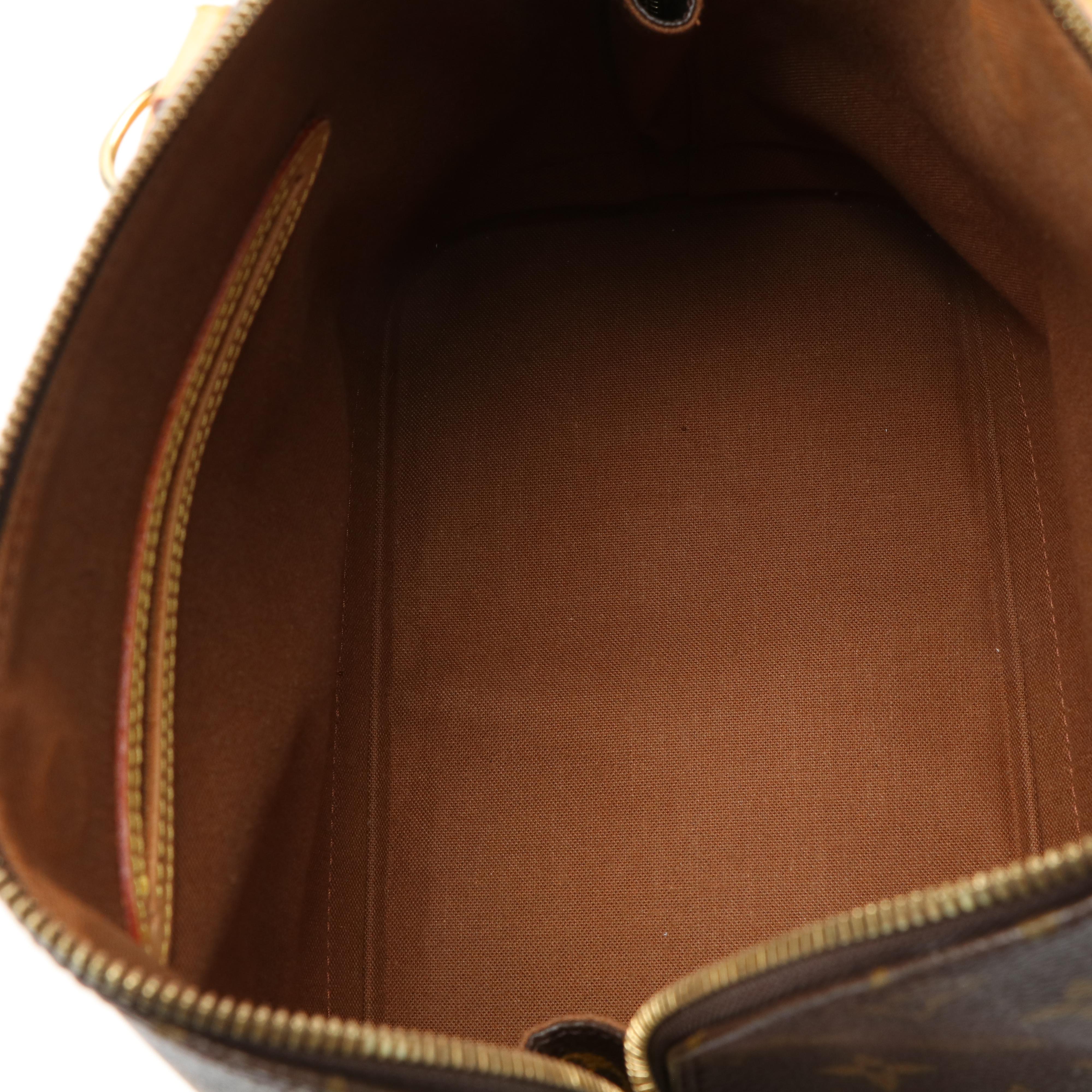 Louis Vuitton Alma PM Bag in Monogram Coated Canvas and Vachetta Leather