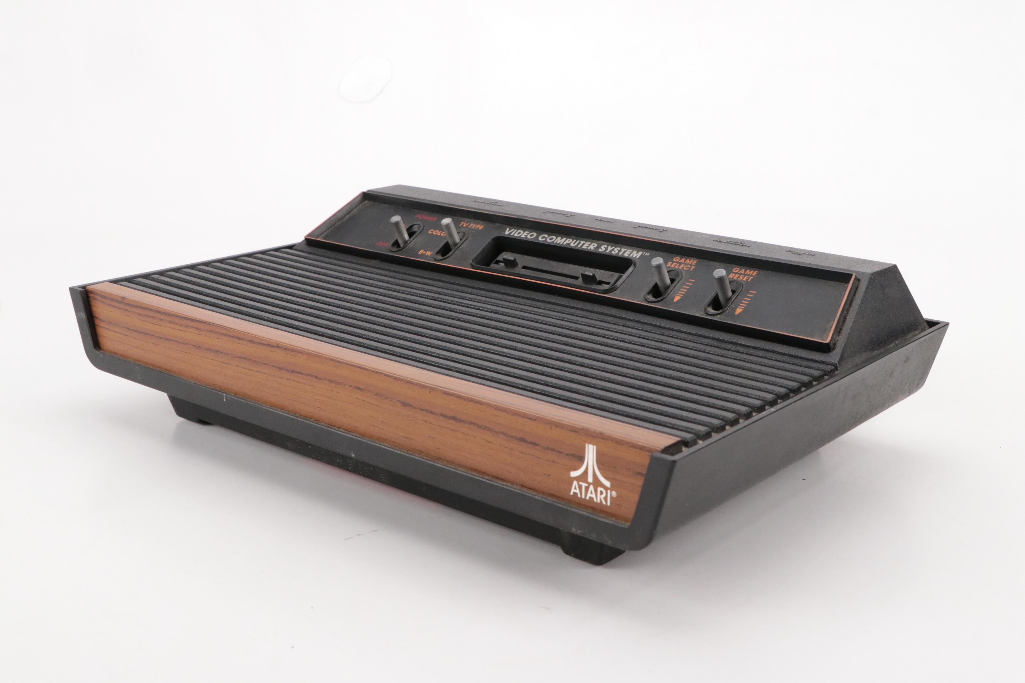 Atari 2600 Console with "Donkey Kong", "Frogger", "Pac-Man", and More