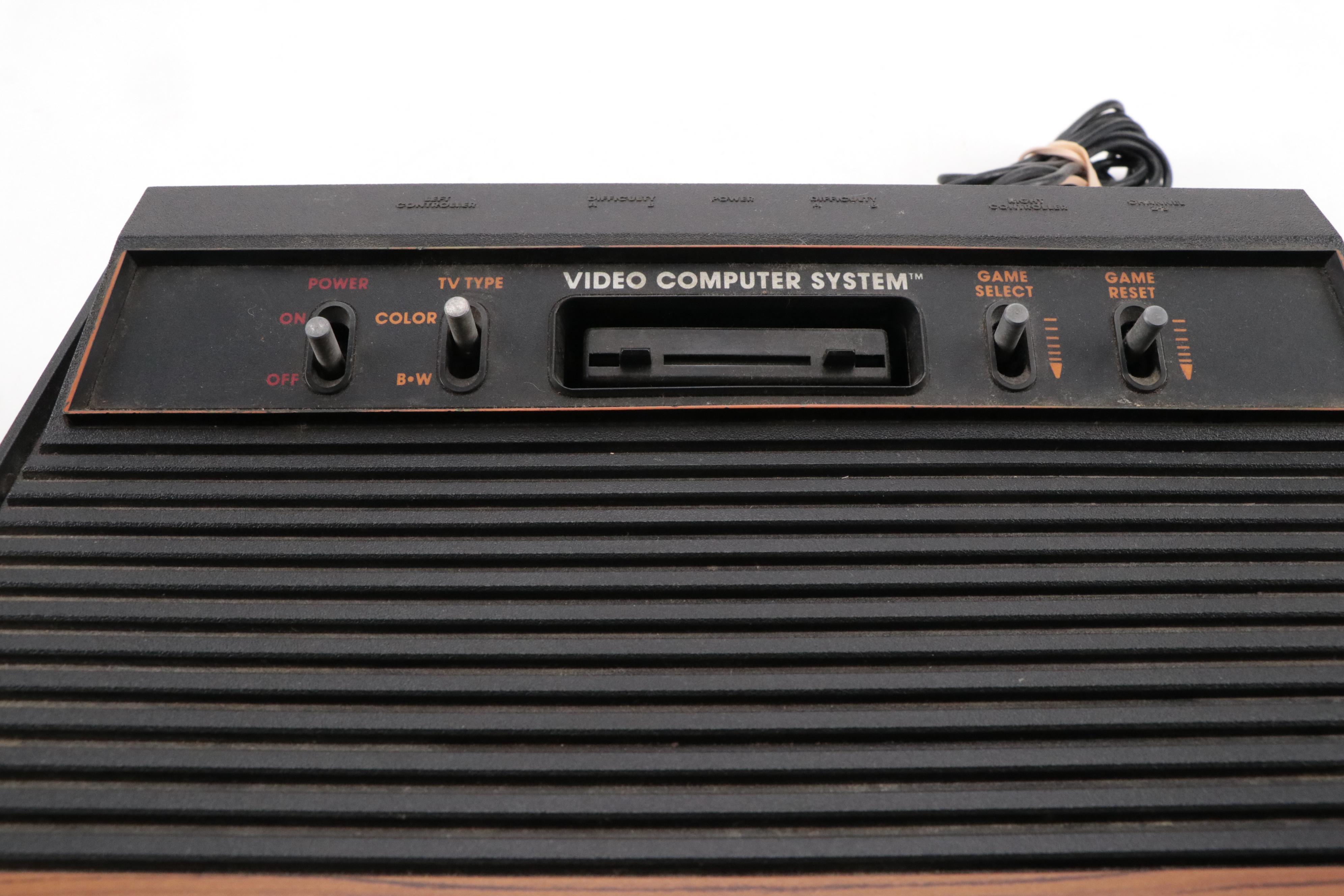 Atari 2600 Console with "Donkey Kong", "Frogger", "Pac-Man", and More