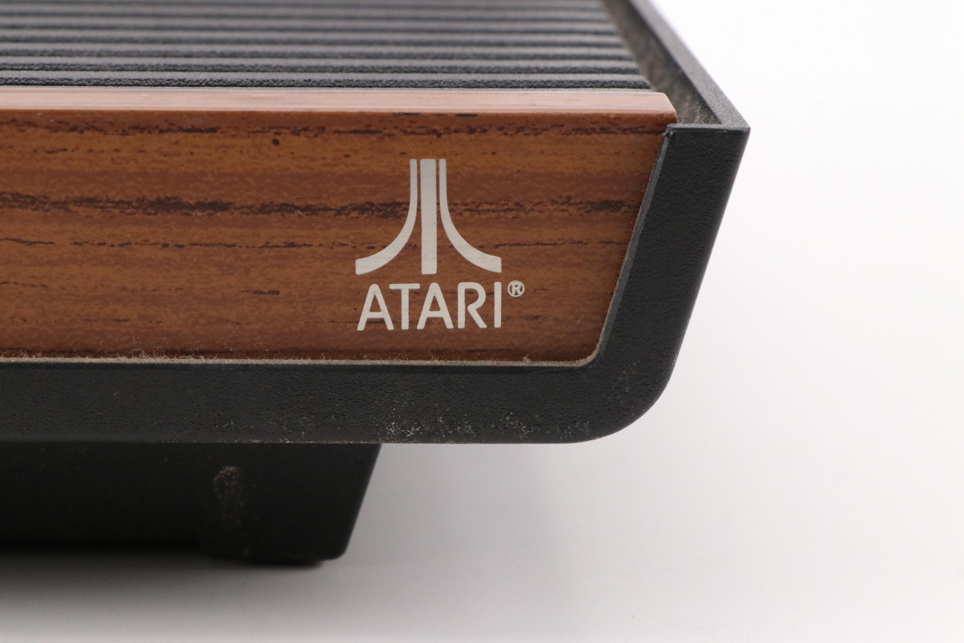 Atari 2600 Console with "Donkey Kong", "Frogger", "Pac-Man", and More