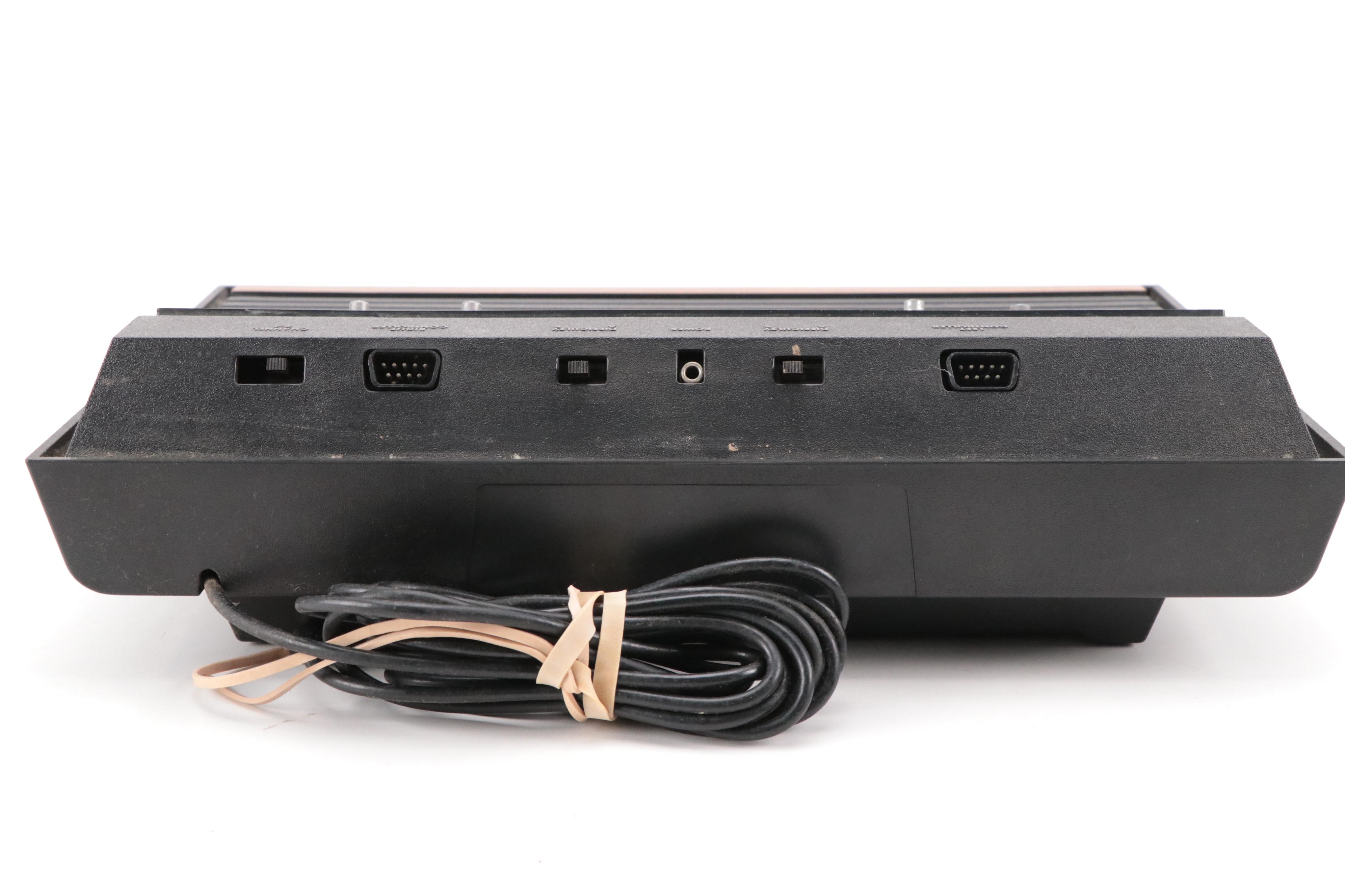 Atari 2600 Console with "Donkey Kong", "Frogger", "Pac-Man", and More